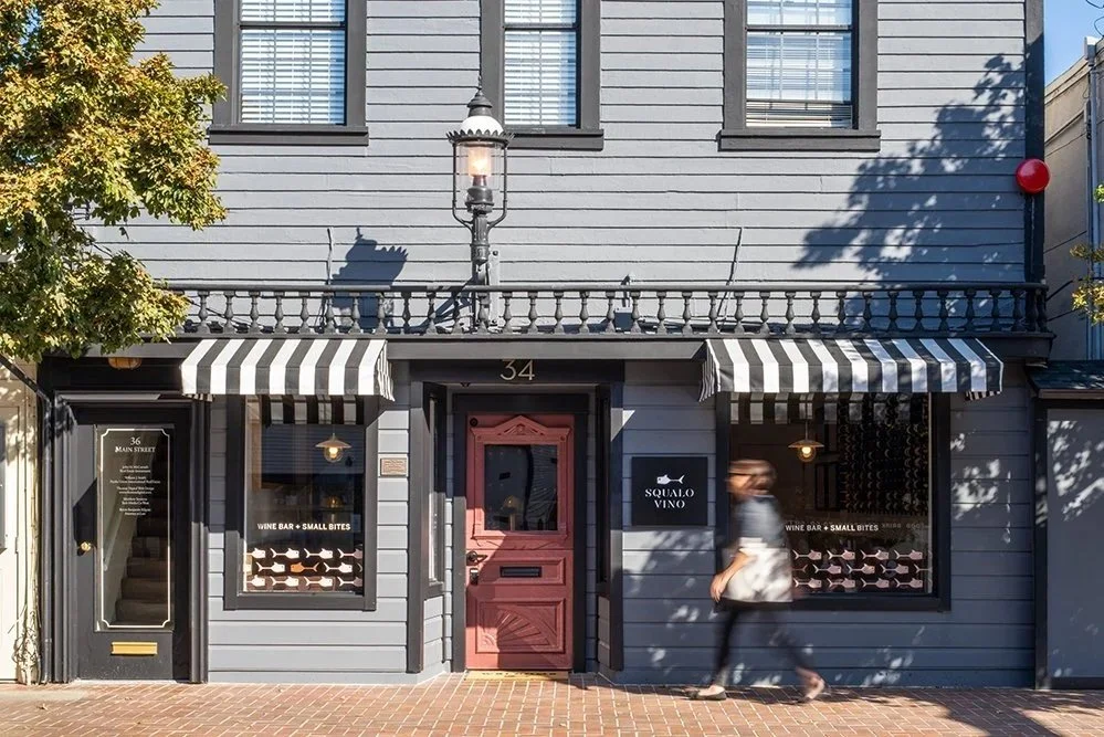 Squalo Vino wine bar exterior on Main Street Tiburon, restored historic storefront with Benjamin Moore historical color palette and shark motif signage