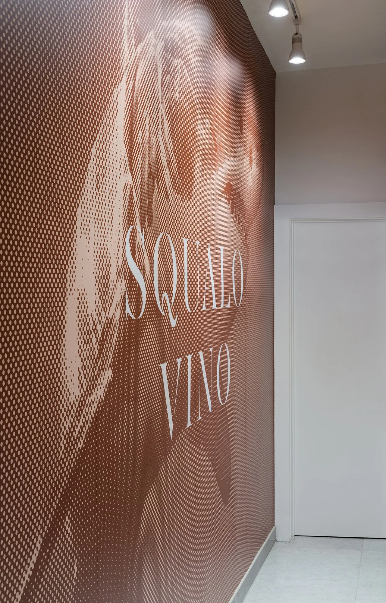 Textured wallpaper detail in Squalo Vino wine bar interior, blending historic Tiburon charm with modern design
