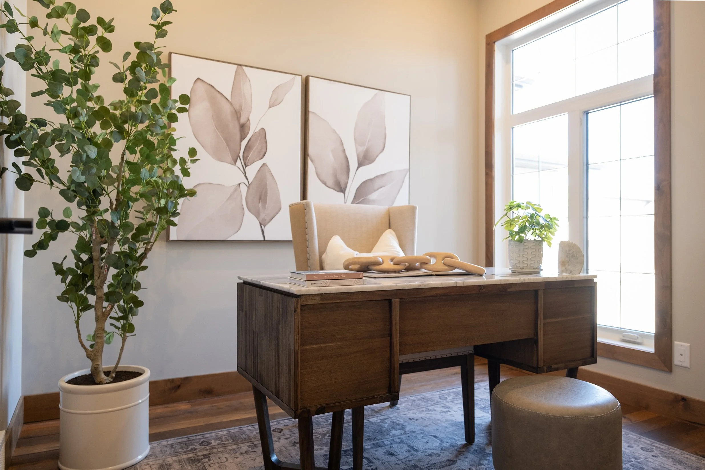 Image of home office with modern wood desk and large window