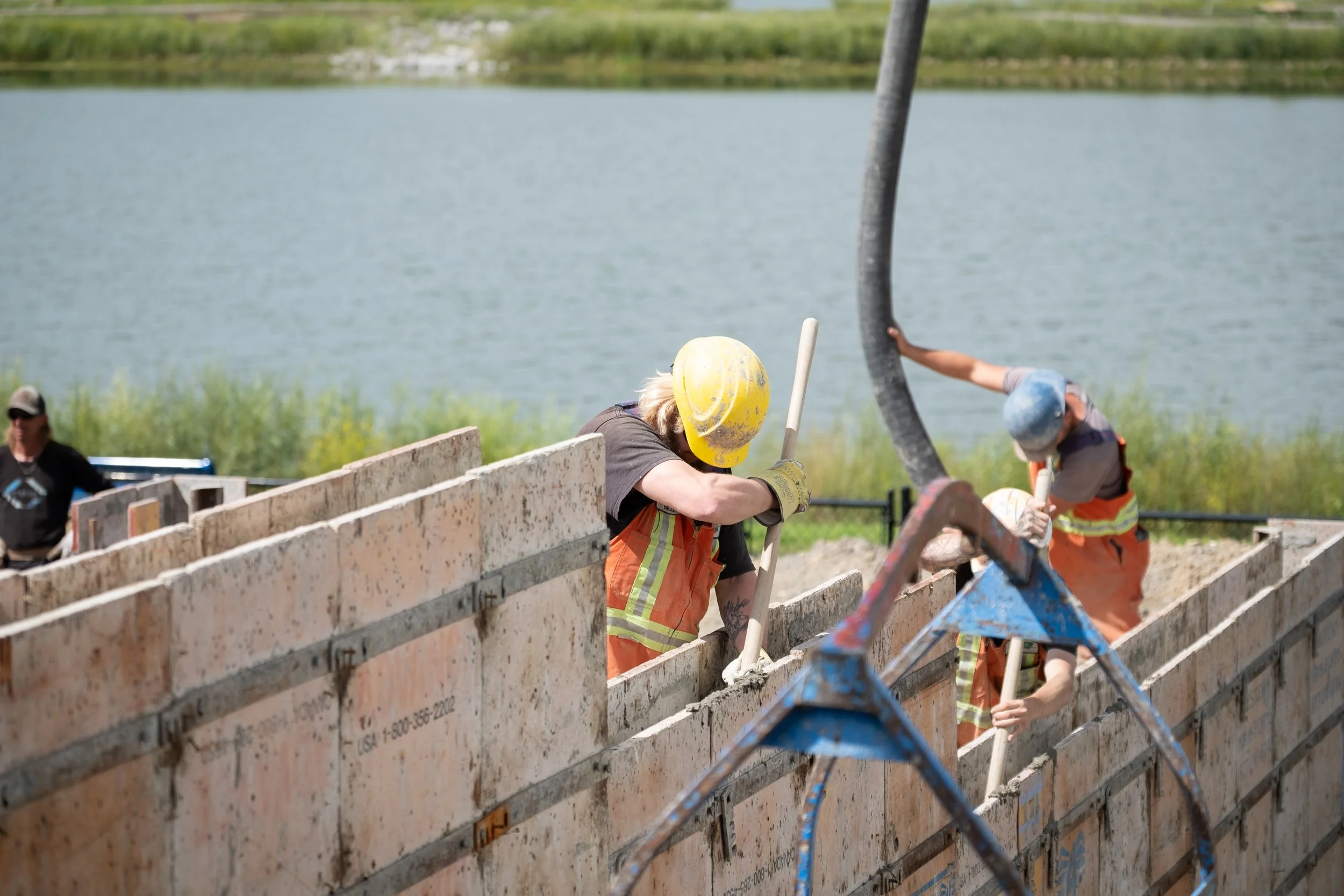 Image of contractors pouring concrete