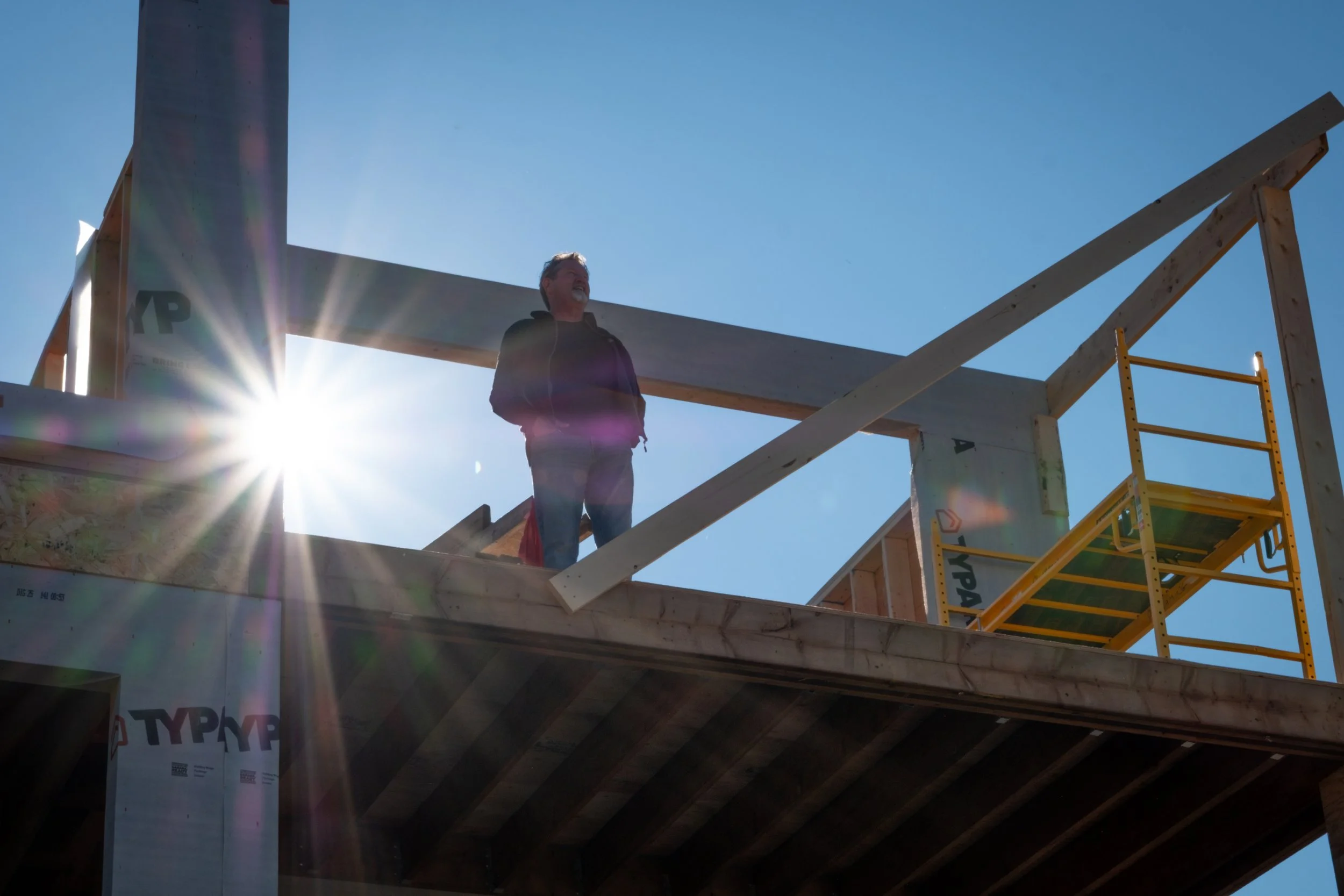 Image of person standing on the second floor of a home under contruction