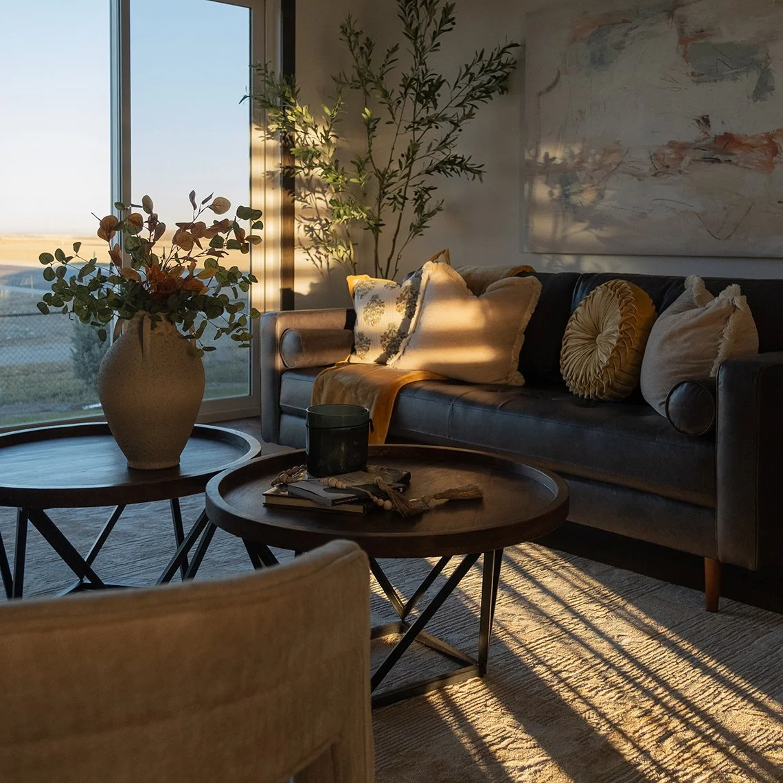 Image of lounge area with sunshine coming through the windows
