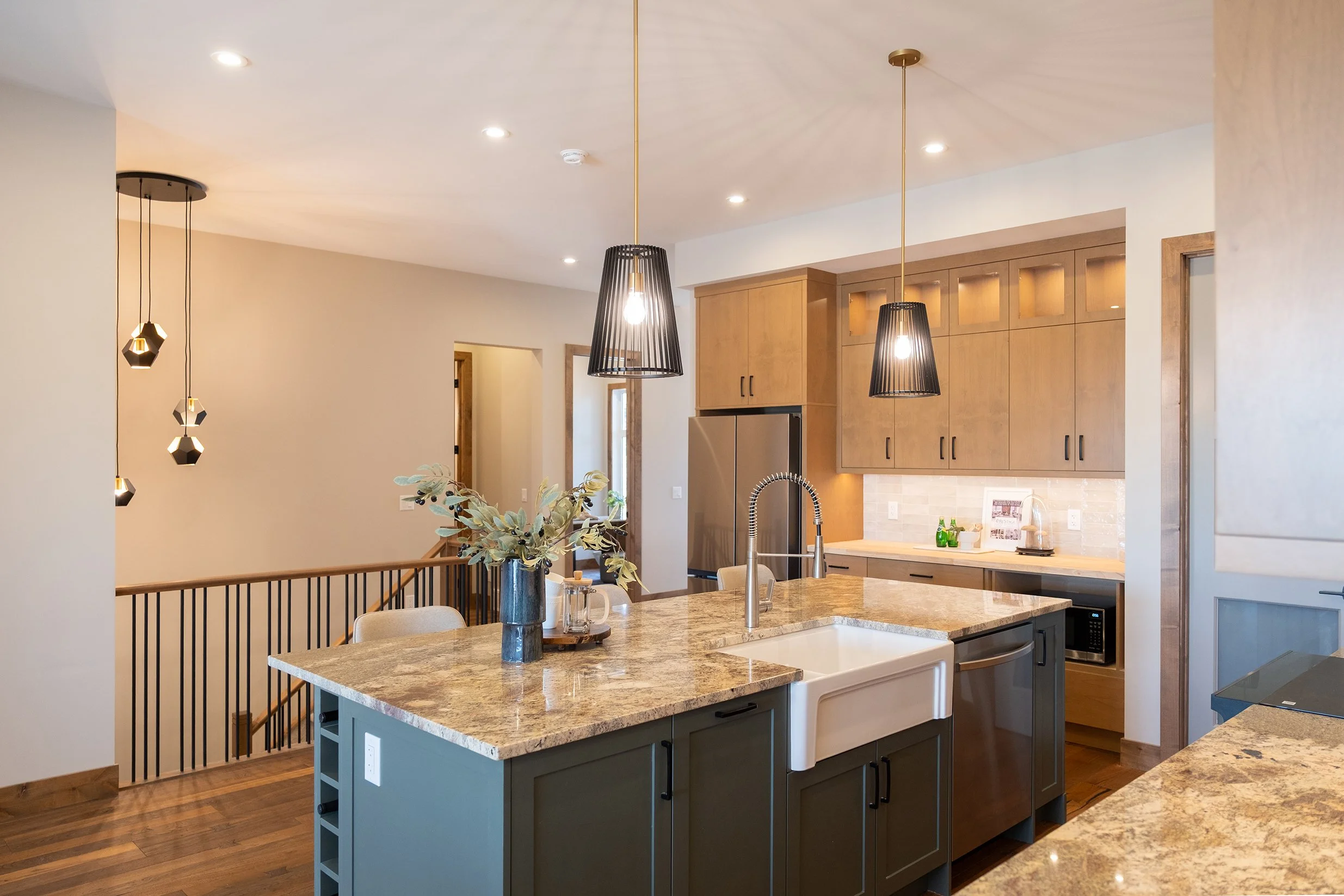 Modern open plan kitchen with sink on island
