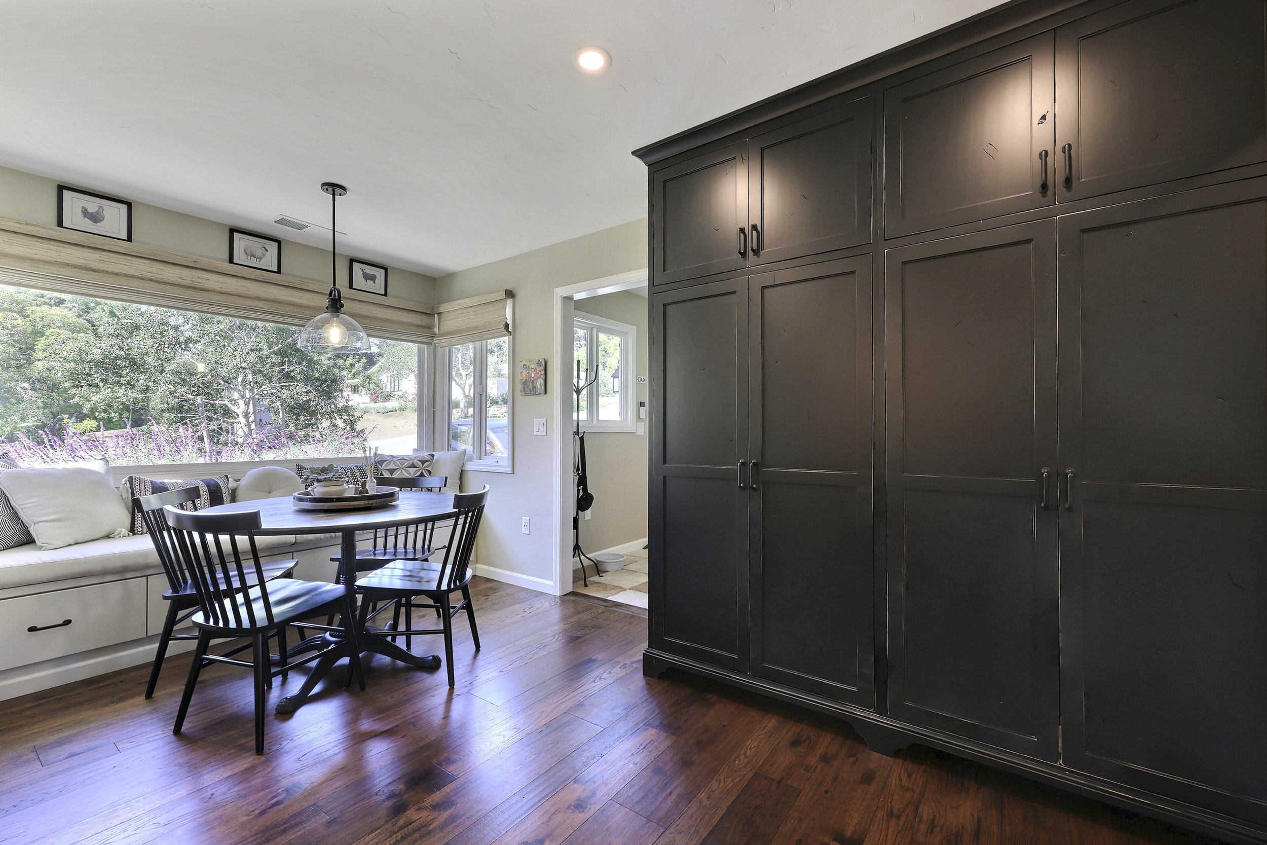 Breakfast nook with storage seating &amp; large pantry!