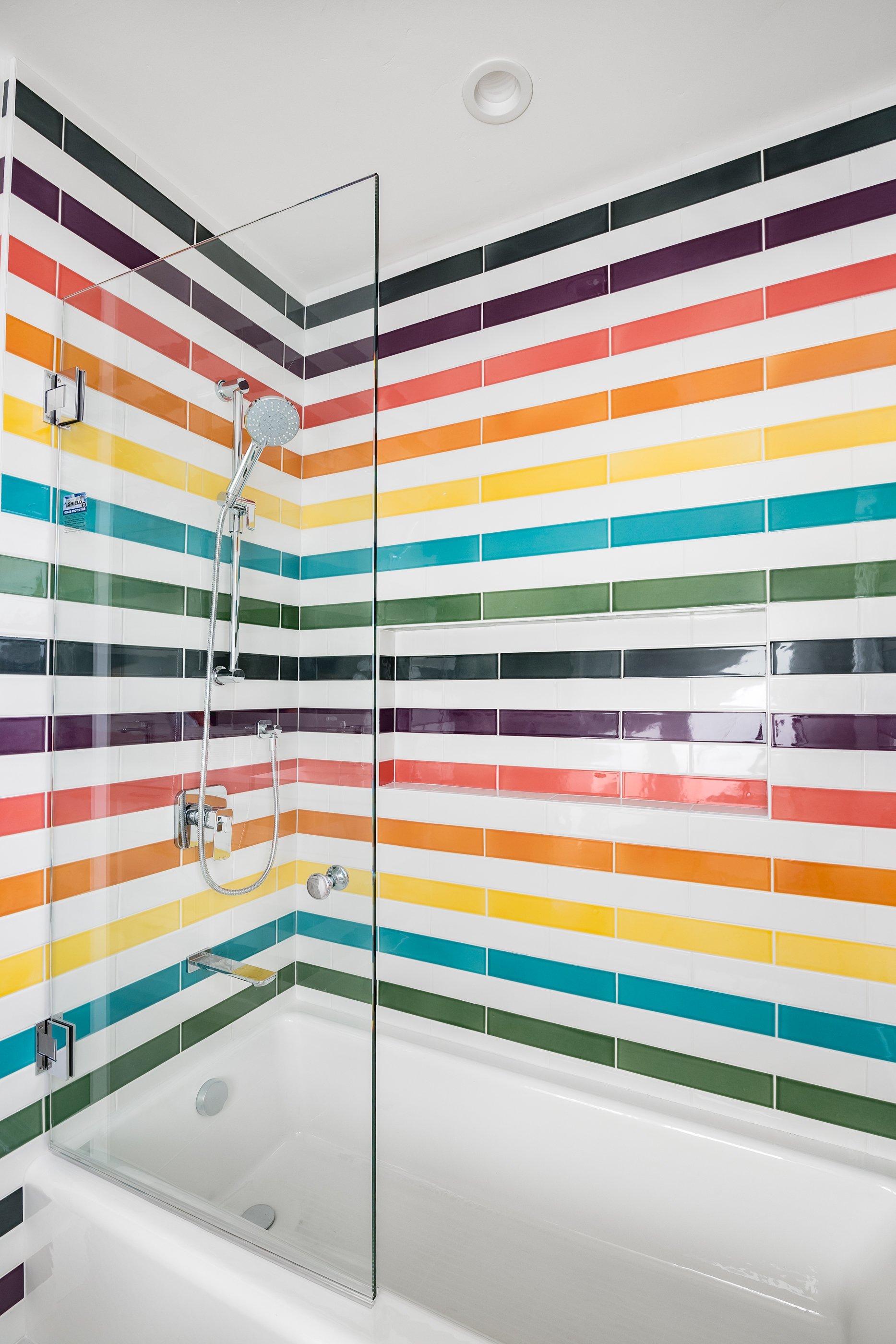 Fun, vibrant rainbow tile make bath time a bit easier.
