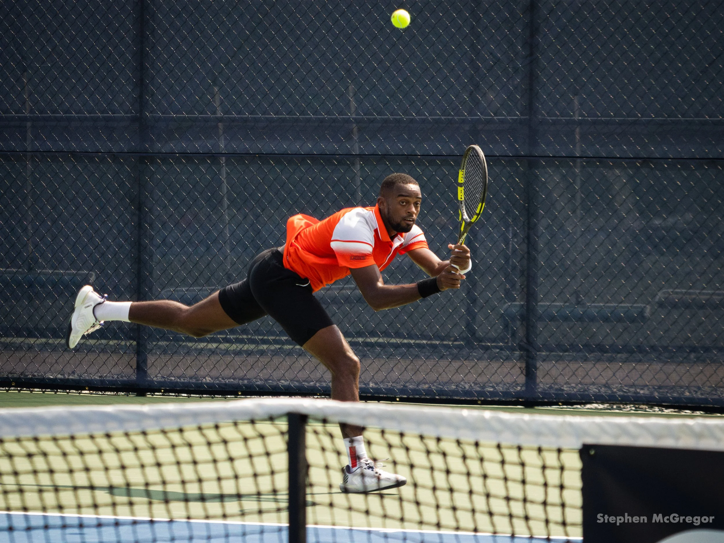 Darian King lunges for the tennis ball in his match.