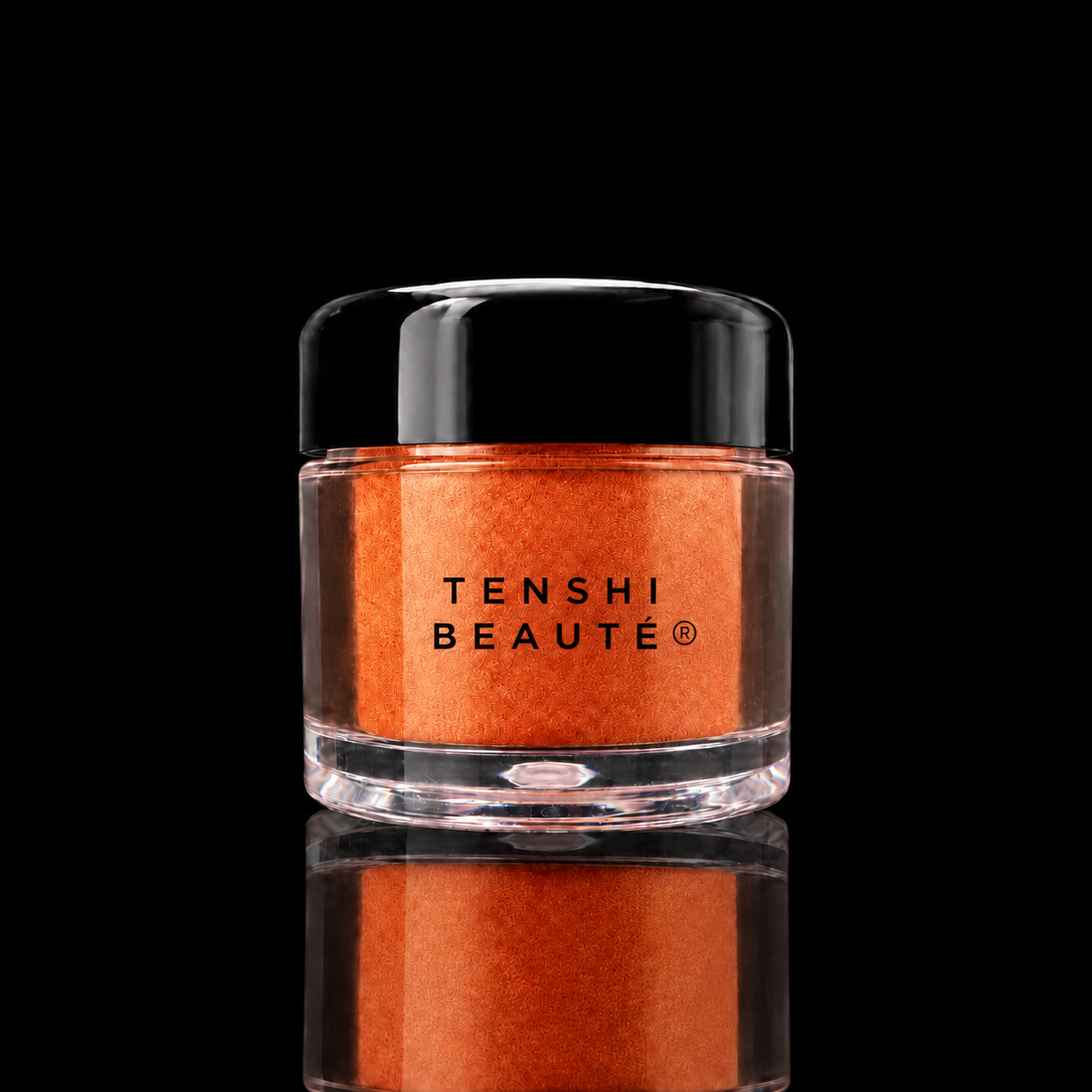 Tenshi Beauté Mandarine orange loose pigment in a clear pot with a glossy black lid and centred black logo.