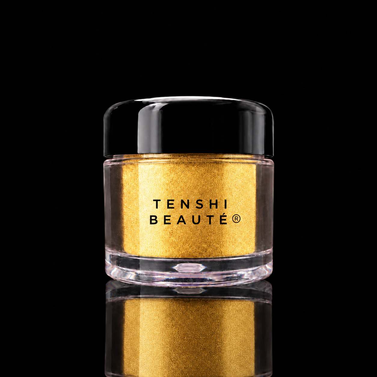 Tenshi Beauté Yuzu Gold loose pigment in a clear pot with a glossy black lid and centred black logo.
