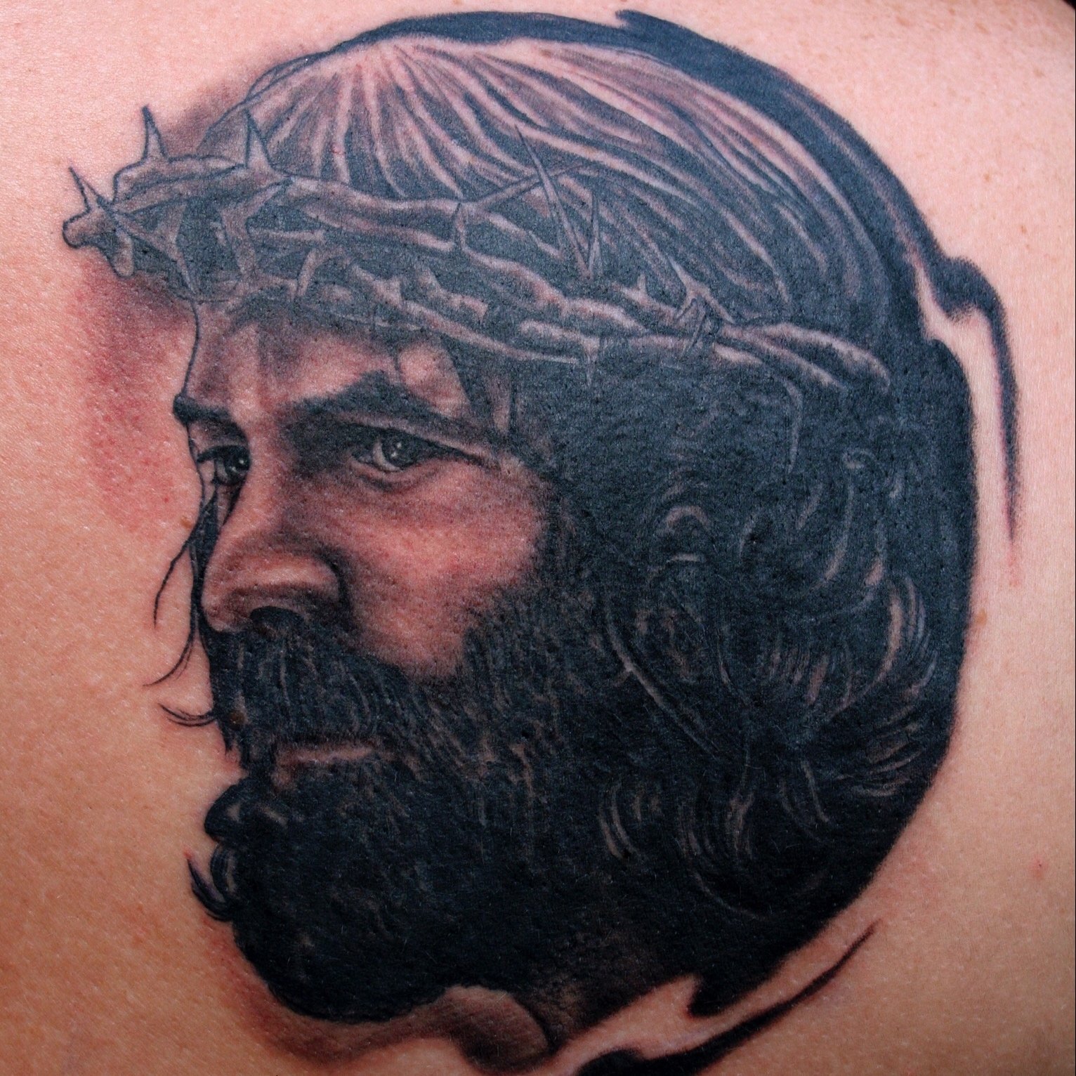 Black and grey portrait tattoo of Jesus Christ
done by Daniel Stewart at Signature Rose Professional Tattooing in Muncie Indiana.