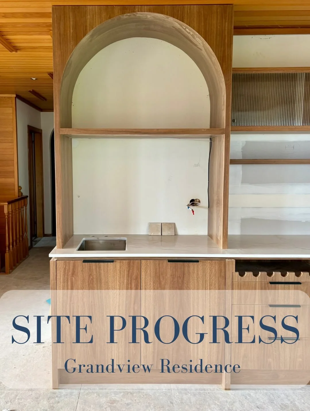 Leaning into the warmth and character of the original home, this renovation brings together a new kitchen, bar and laundry designed for the way this busy family lives and entertains.

Rich timber joinery, soft curves and layered natural textures feel