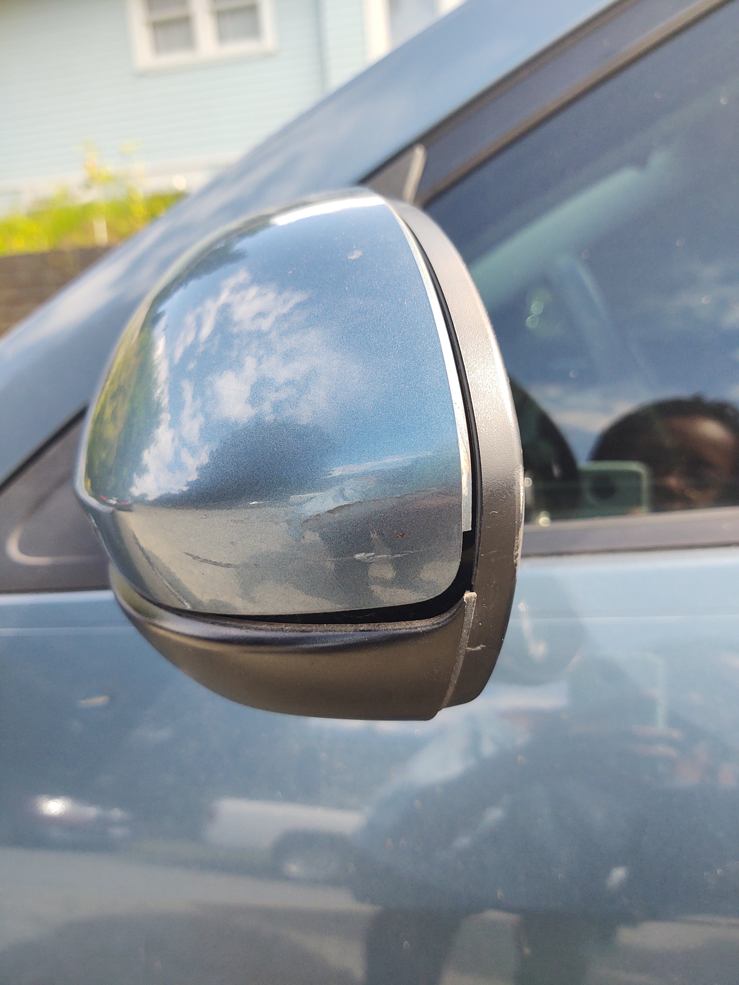 A photo of the author's damaged rear view mirror on June 24, 2020.