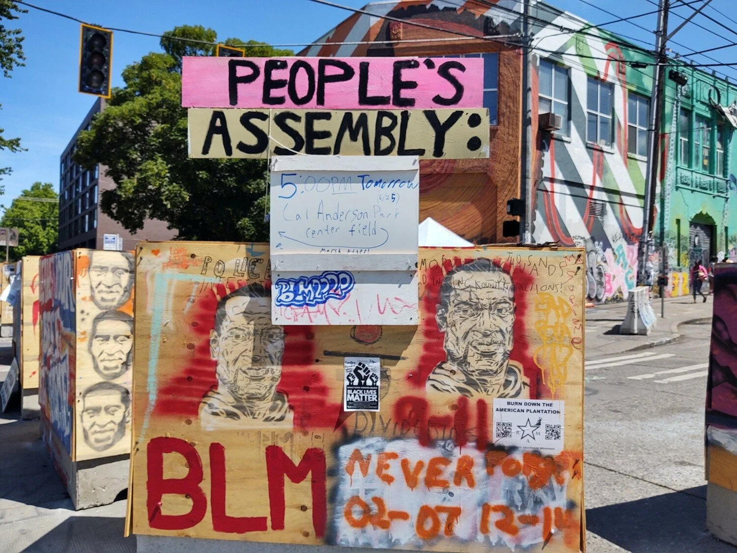 A sign announces a People’s Assembly. All photos June 25