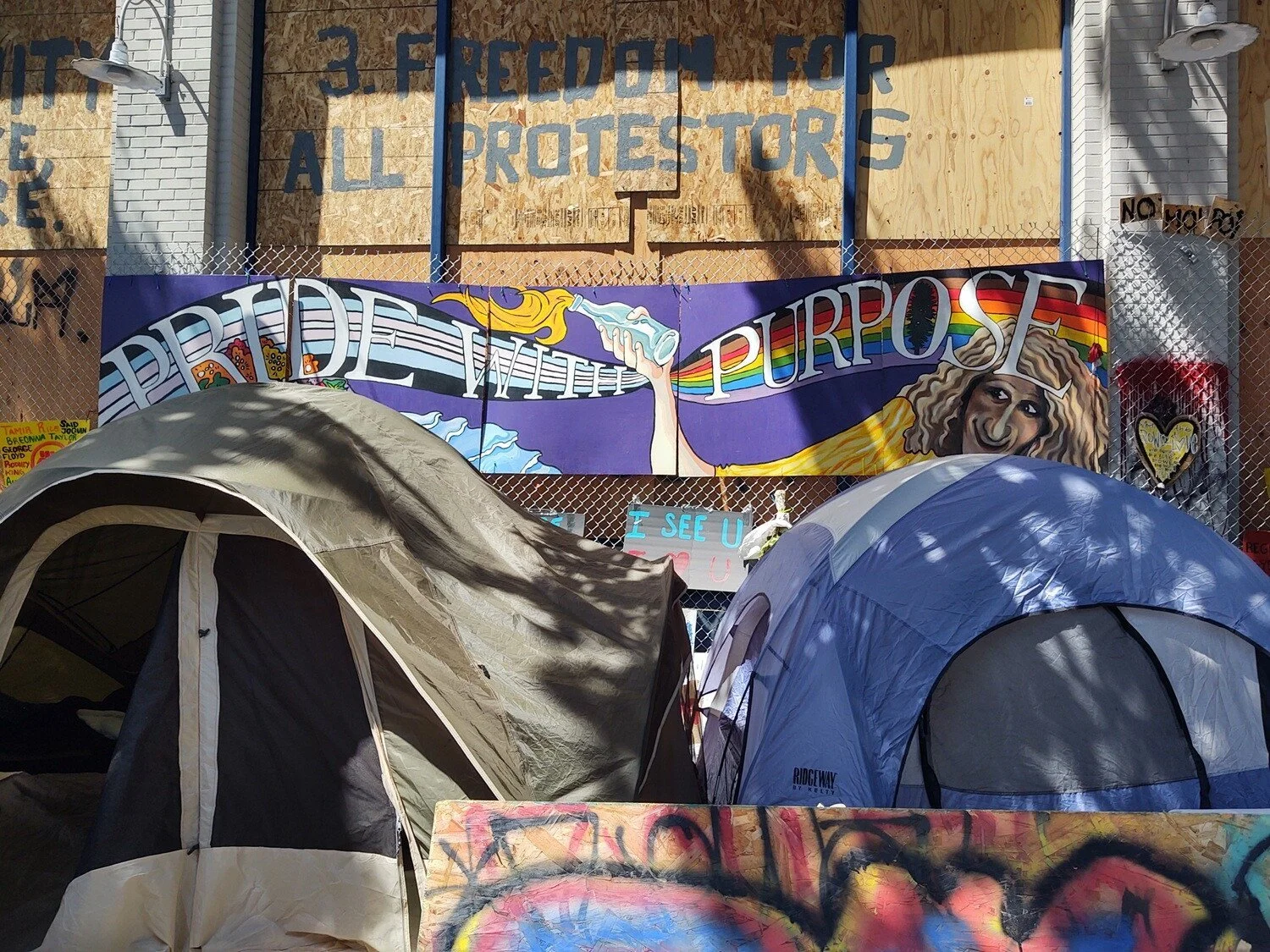 Tents on the sidewalk at East Precinct. 