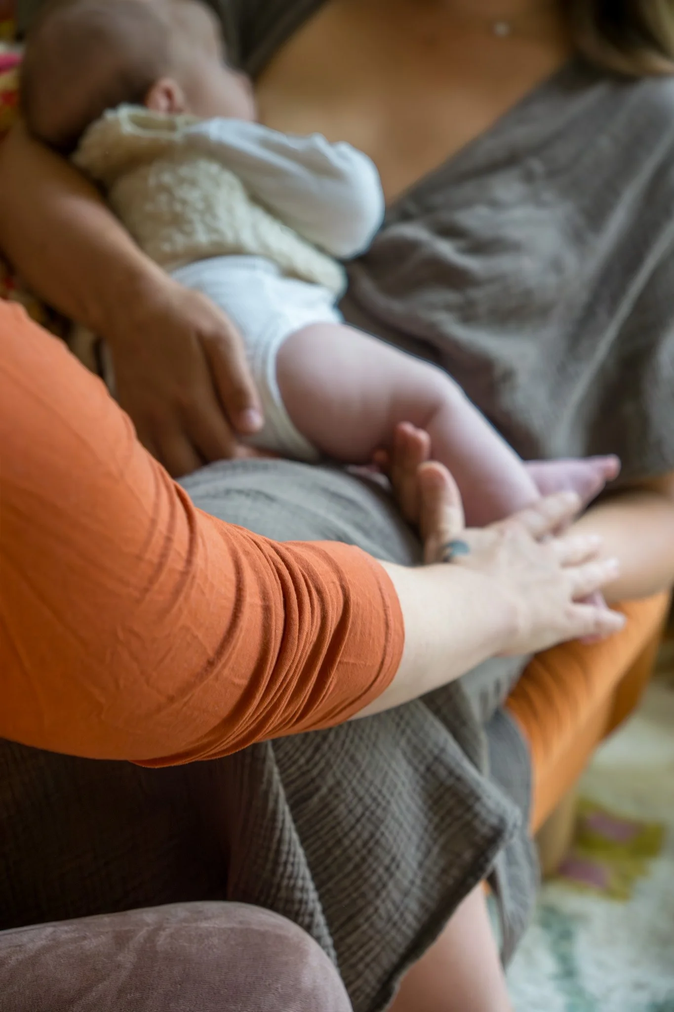 mother and child being cared for by post partum nurse