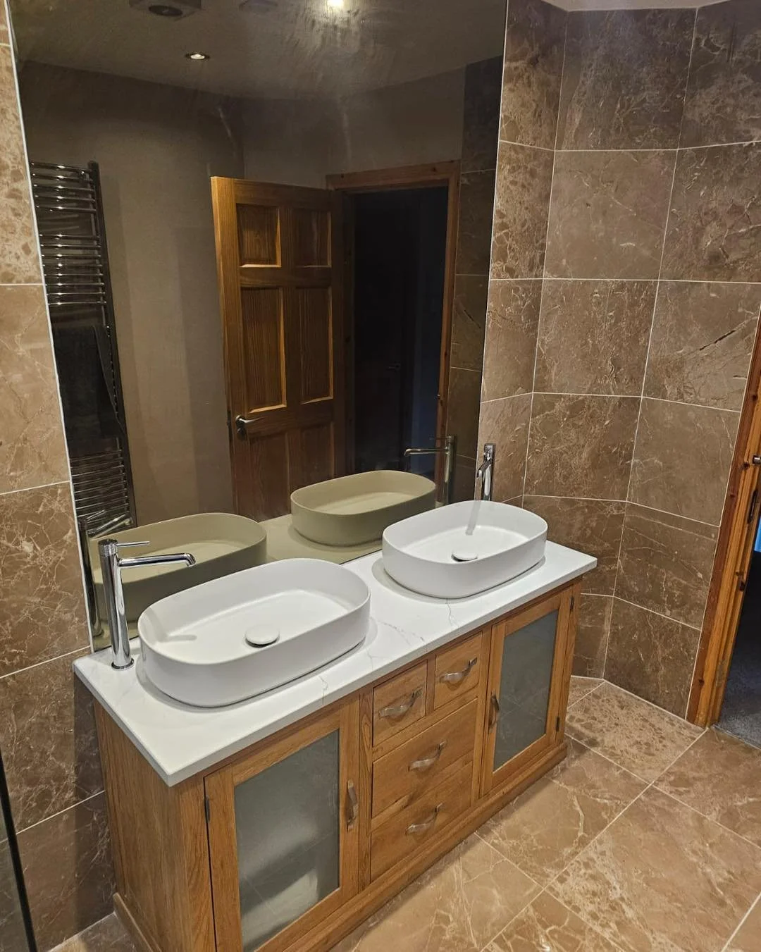 Transforming spaces, one sink at a time! ✨💧 We recently revamped this double sink setup by keeping the original unit and upgrading with two luxurious new basins. The result? A perfect blend of classic charm and modern elegance that brings fresh life