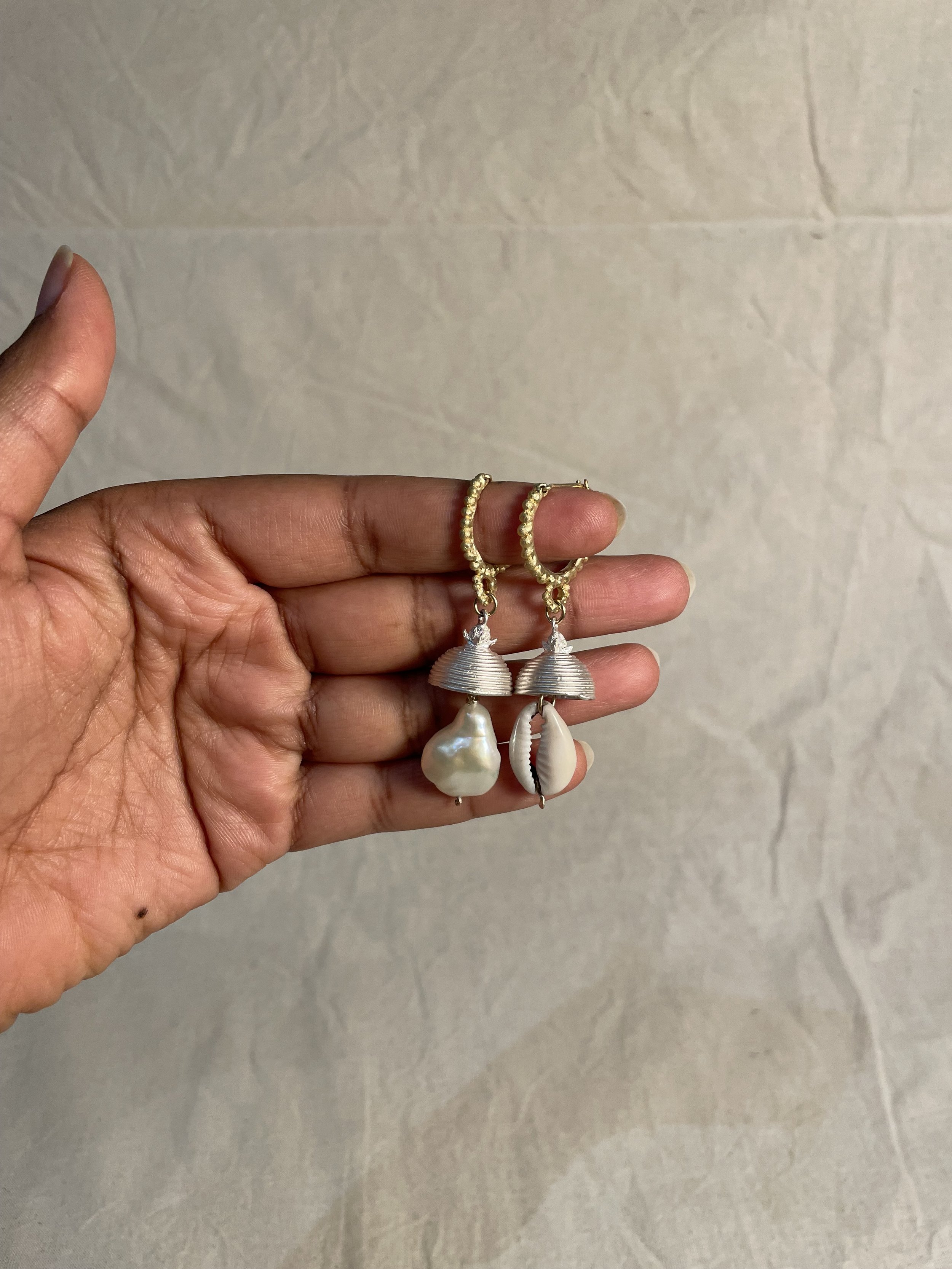 18ct yellow gold mustard seed hoop, silver clove dome, baroque pearl and cowrie shell