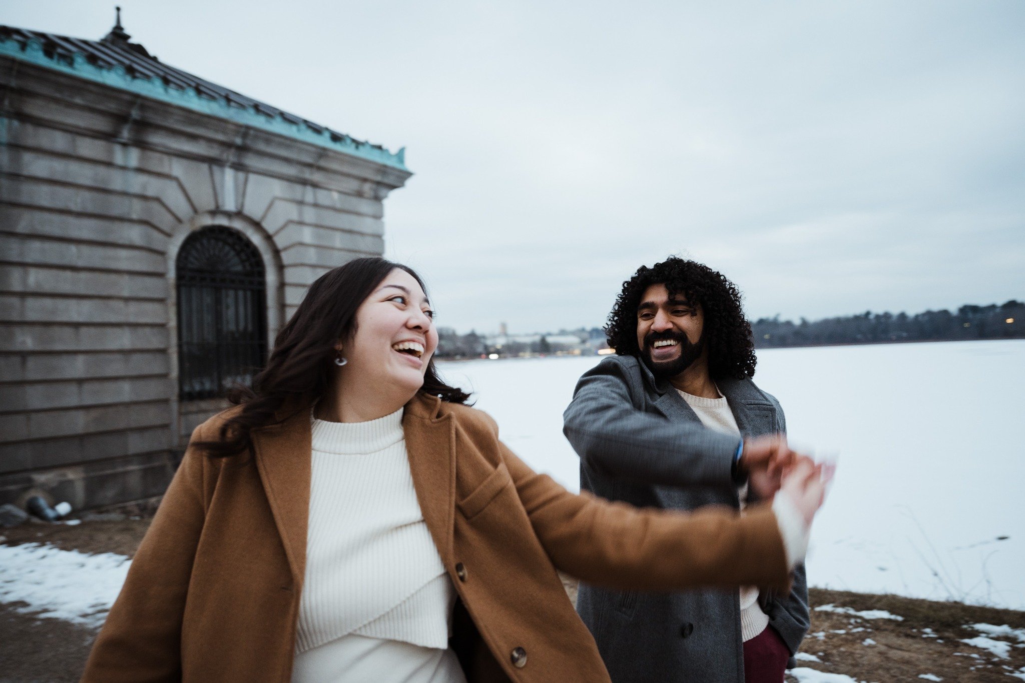 massachusetts-engagement-session-winter-laughing-couple-walking-lakeside-016.jpg
