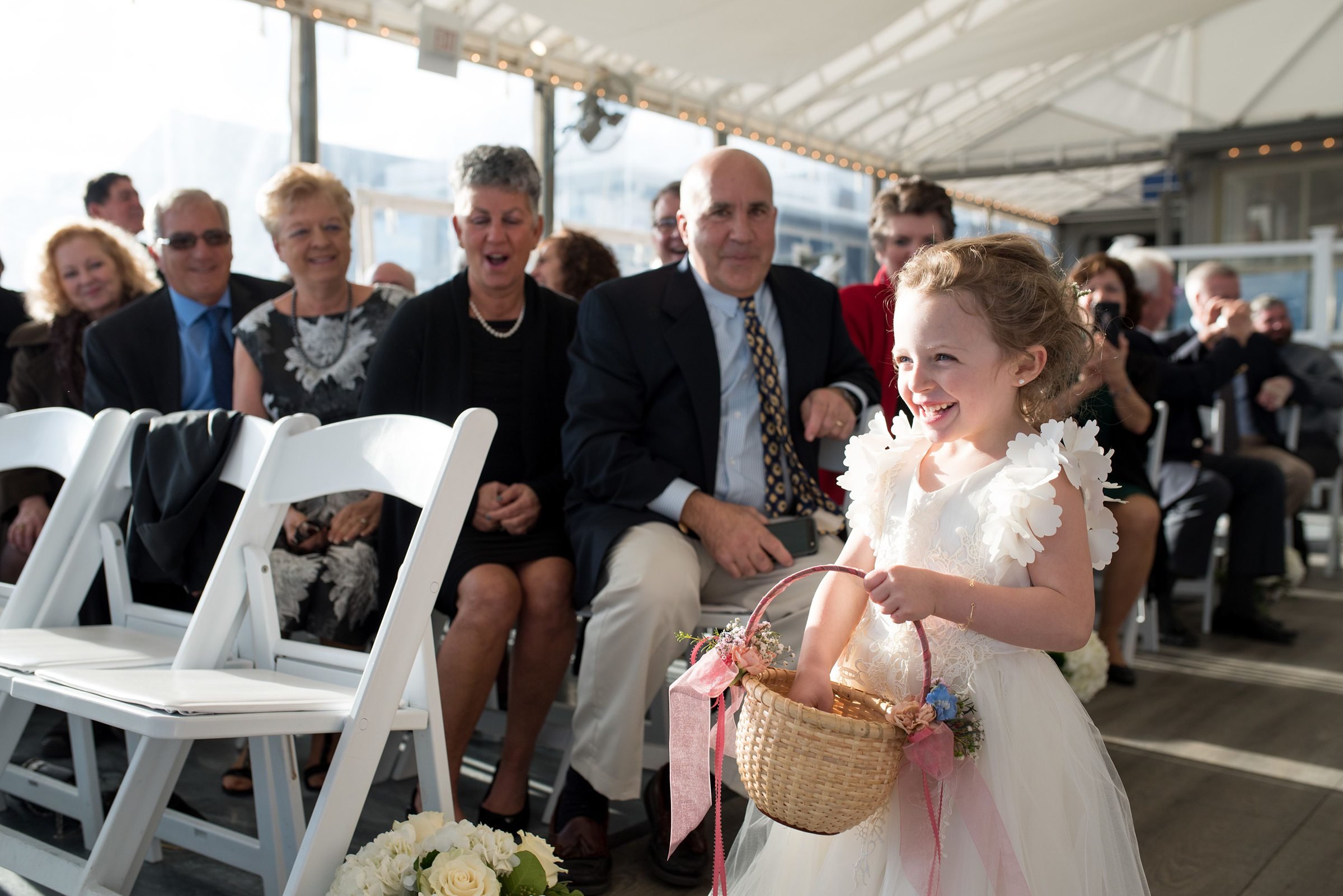 Popponesset Inn Wedding Ceremony with flower girl walking down the aisle