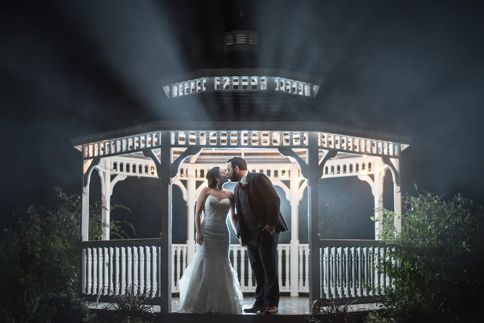 new-england-wedding-photographer-nighttime-flash-portrait-couple-kissing-under-gazebo-005.jpg