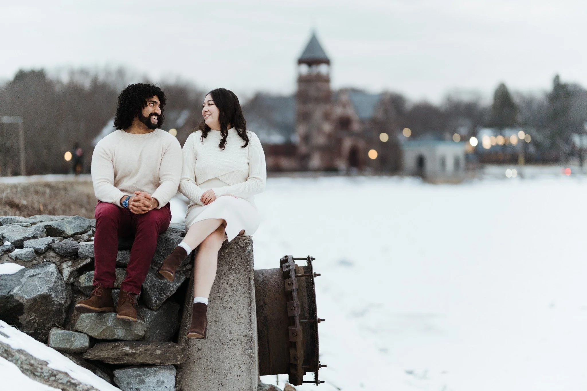 massachusetts-engagement-session-winter-couple-on-rocks-historic-tower-backdrop-015.jpg