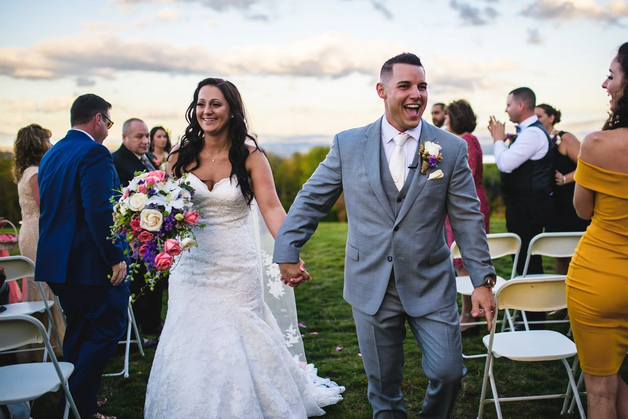 massachusetts-wedding-photographer-ceremony-exit-bride-and-groom-walking-smiling-002.jpg