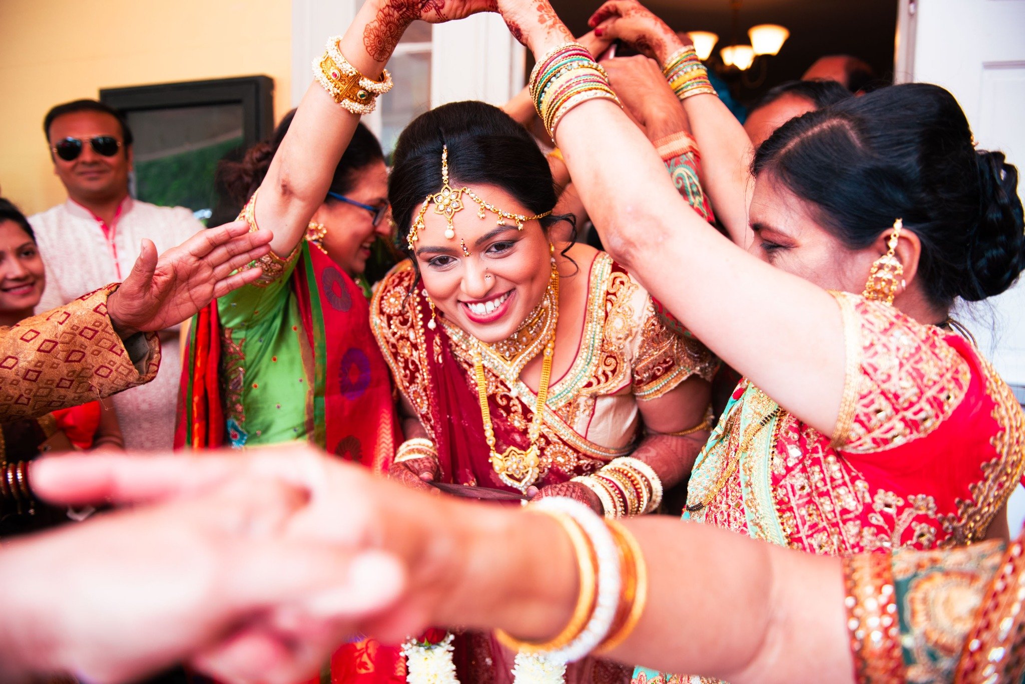 new-england-wedding-photographer-indian-wedding-bride-surrounded-by-family-traditions-012.jpg
