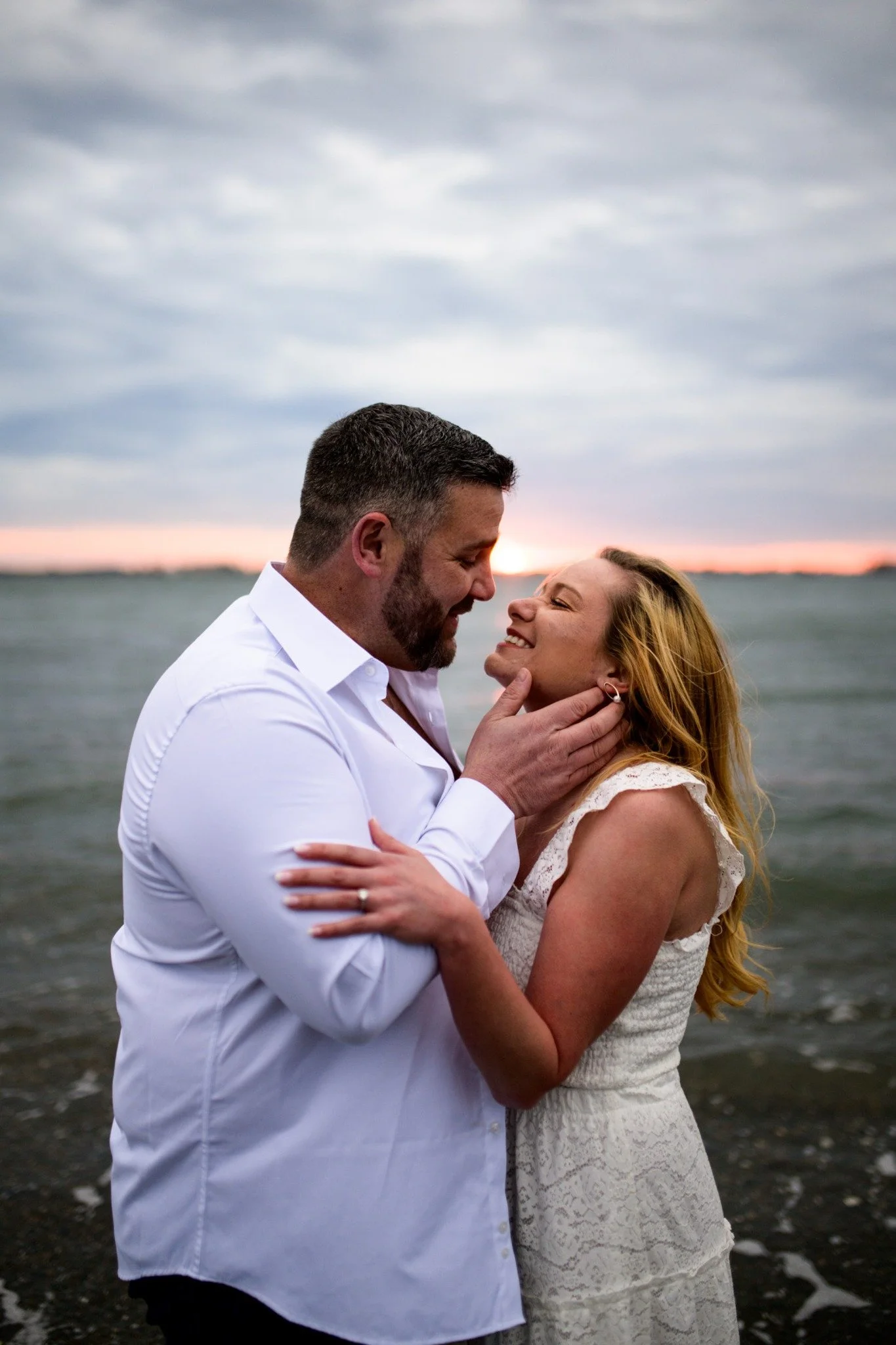 massachusetts-engagement-session-beach-sunset-close-portrait-couple-smiling-020.jpg