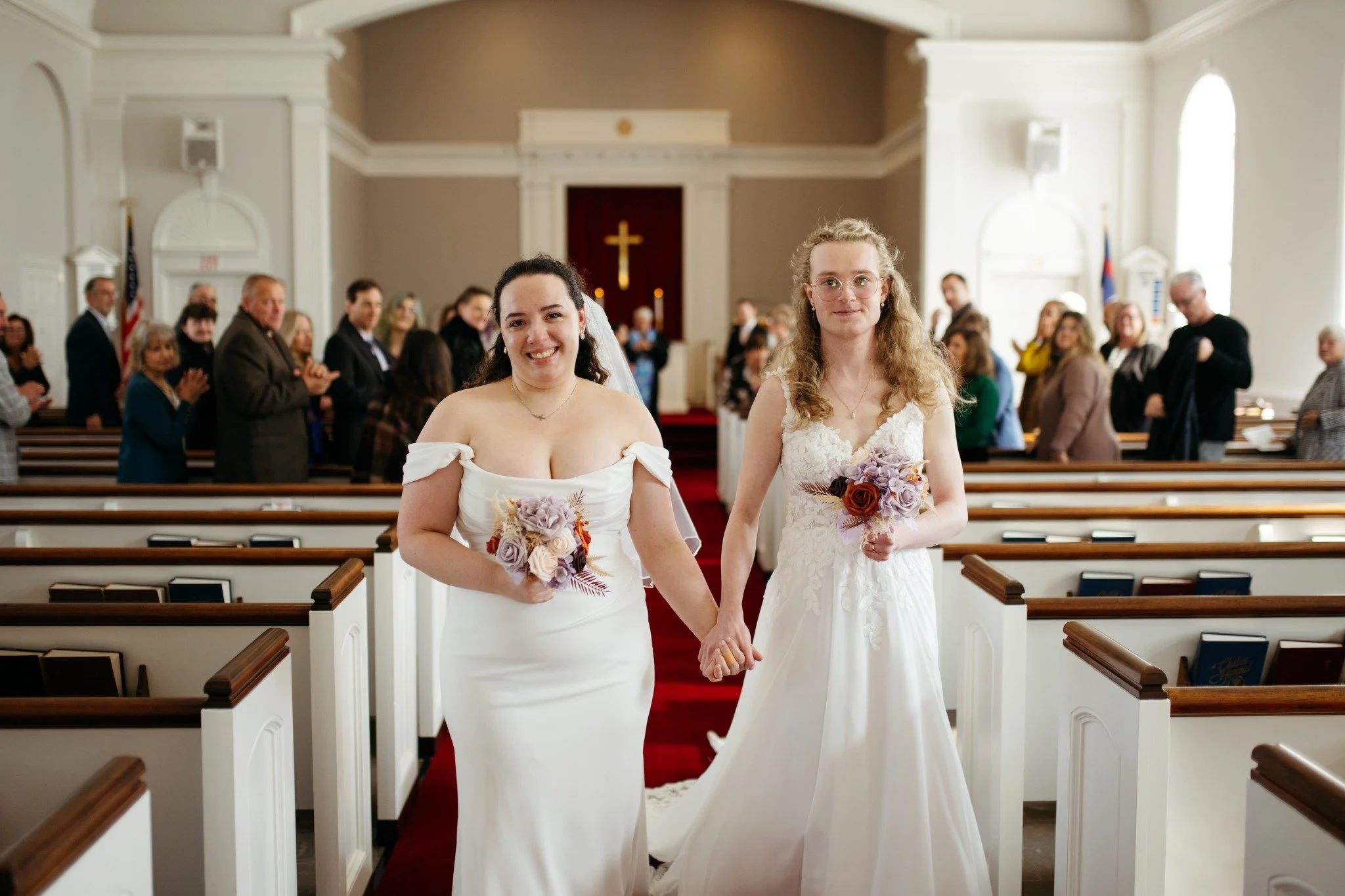 massachusetts-wedding-photographer-two-brides-church-ceremony-exit-hand-in-hand-043.jpg