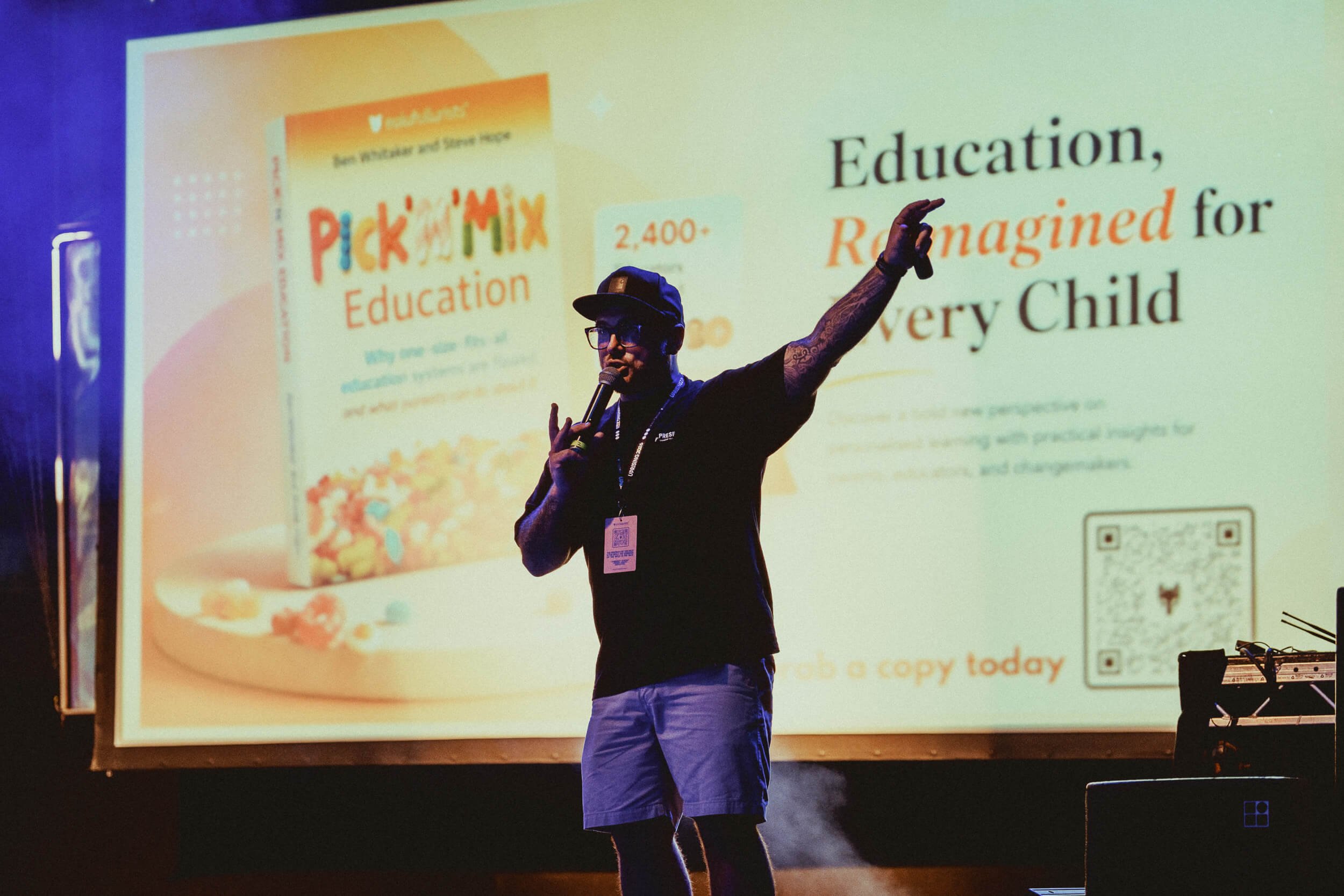 Speaker presenting to guests during an end-of-year education event.