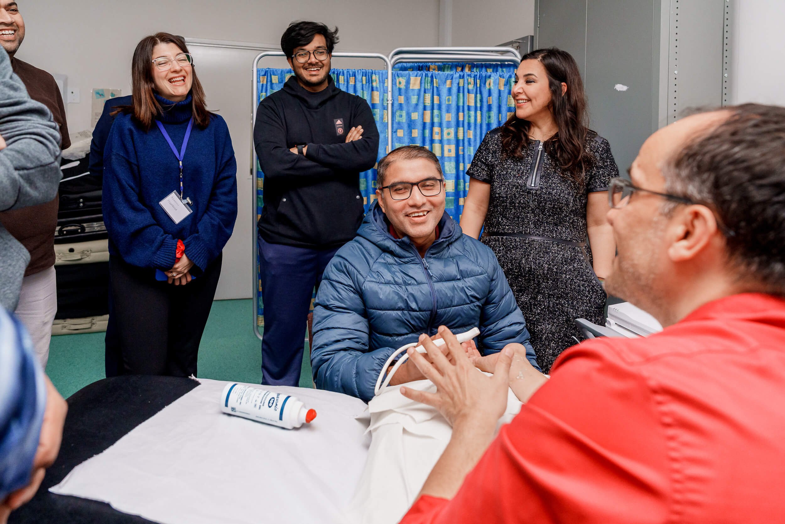 Participant smiling while taking part in an interactive group exercise.