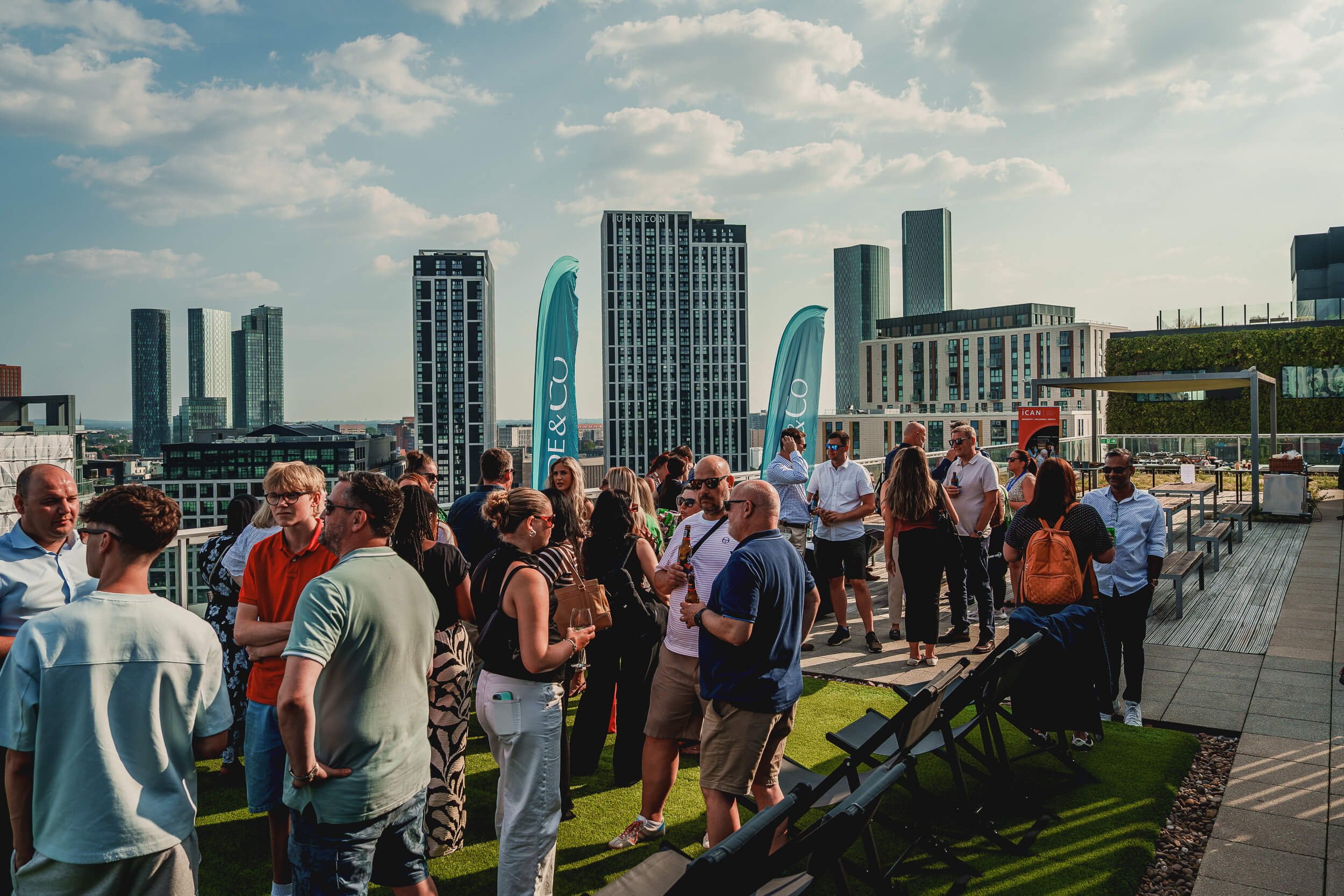 Guests networking outdoors at a large professional event in Manchester.