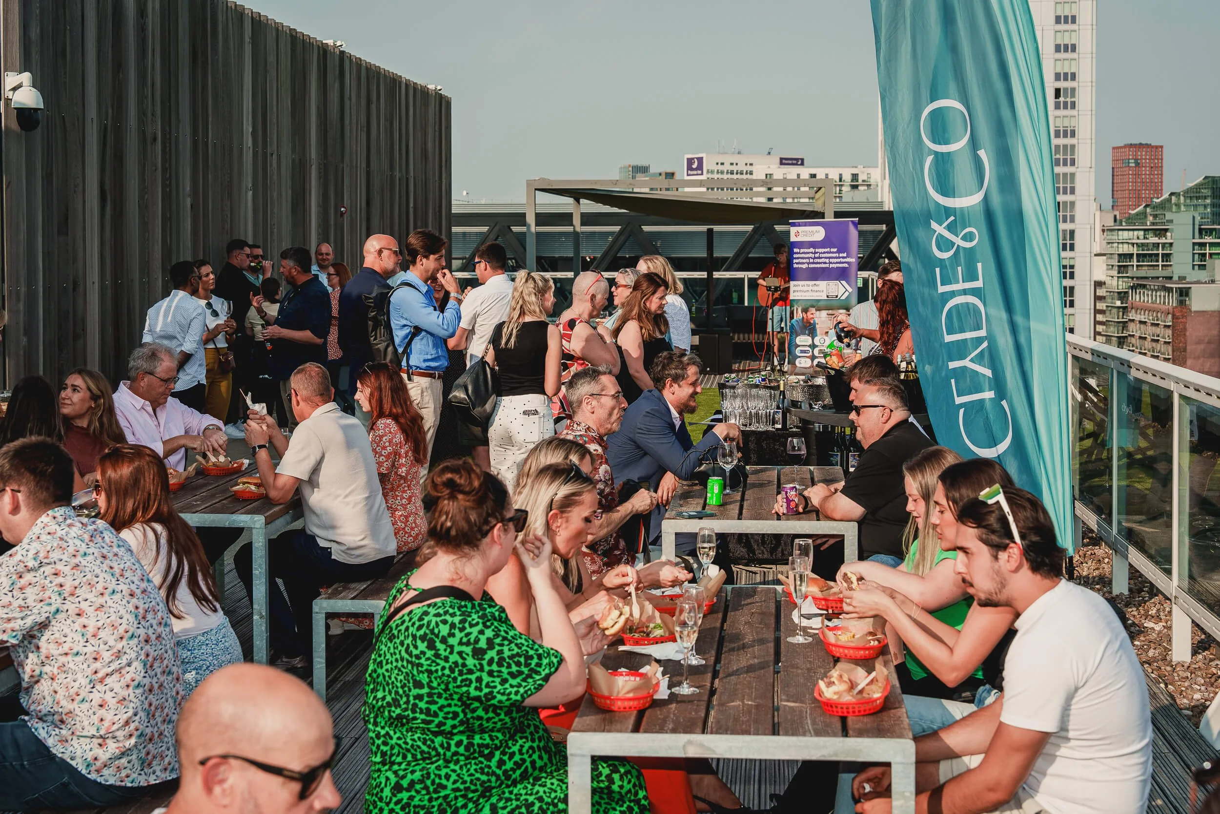 Guests networking at a busy outdoor business event