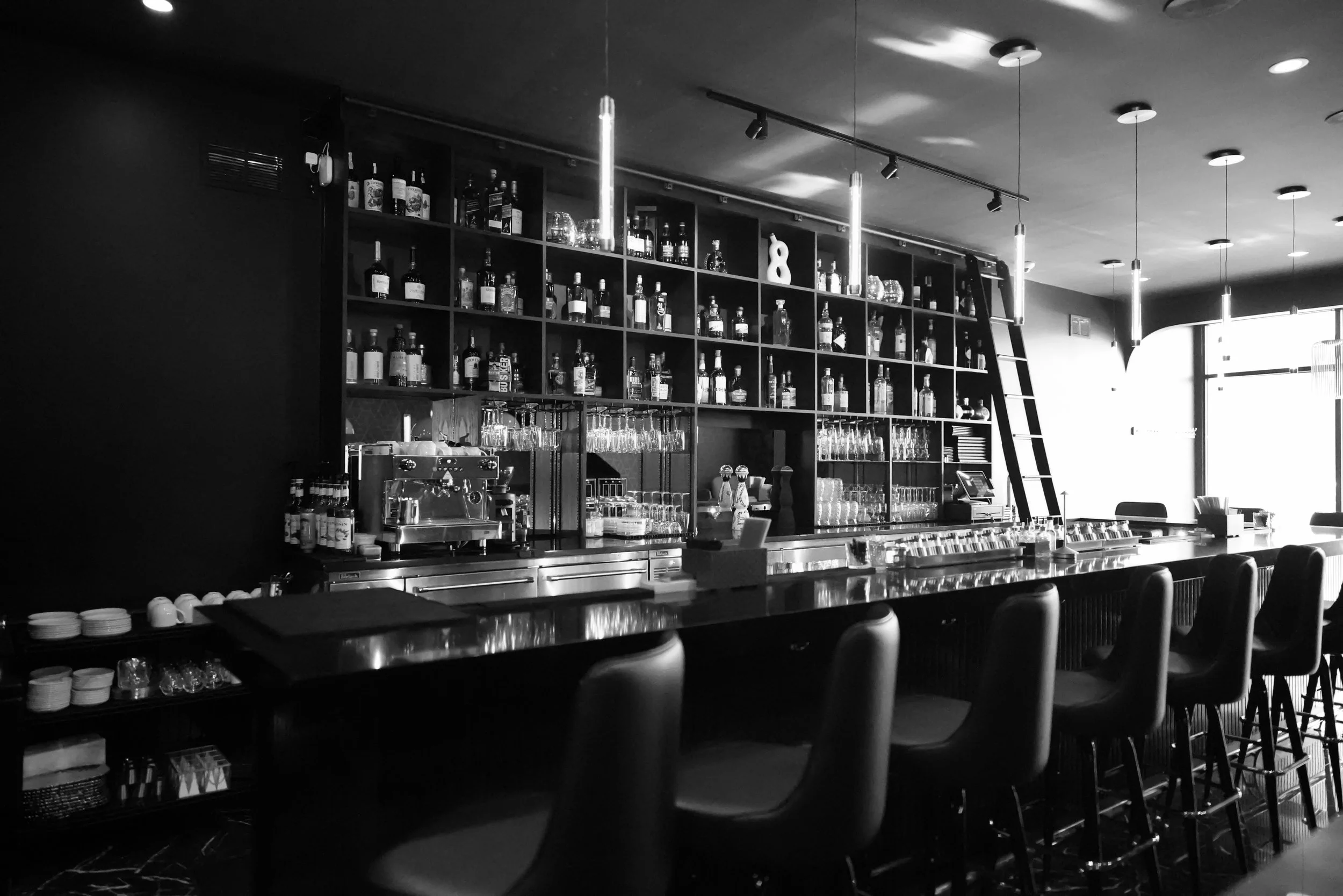 A photo of the elegant bar interior at Silk Utica, an upscale cocktail and dessert bar located at 104 Genesee Street in Utica, New York.