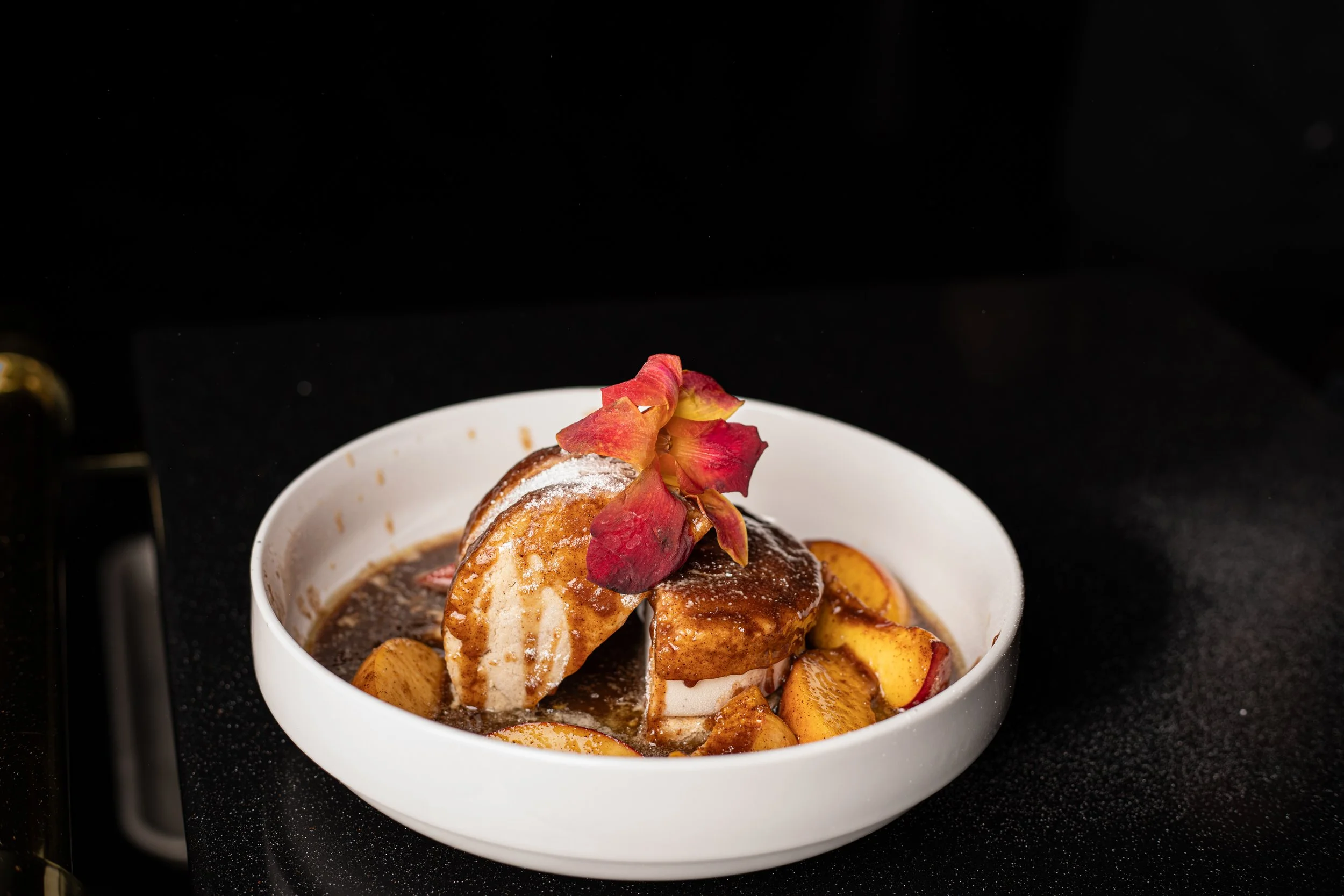 Peach foster dessert at Silk cocktail bar small plates and dessert destination in Utica NY