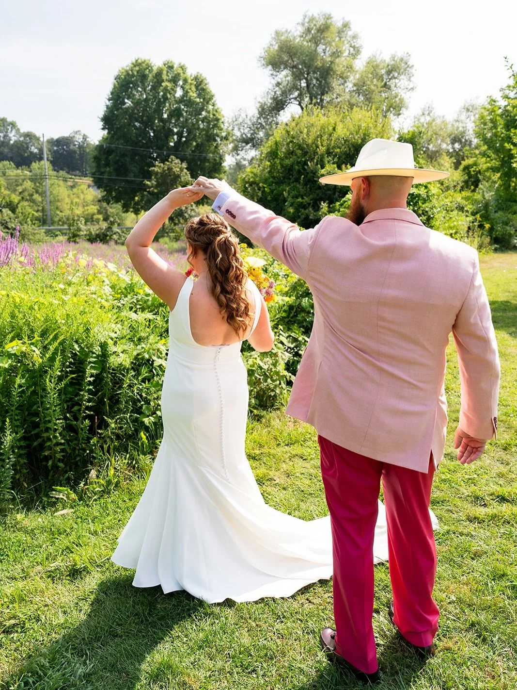 This song. These pictures. Is someone cutting onions?! UGH love these humans! 

Wildflowers, August sun, and a pink suit moment. A first look that felt easy, joyful, and true to H&amp;P. ☺️✨

Wedding planning &amp; design @ashleyfidlerevents 
Photogr