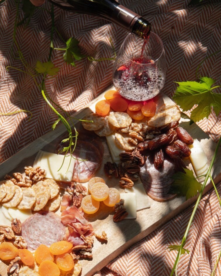 Right from the vine, a charcuterie picnic with a bottle of Pinot.