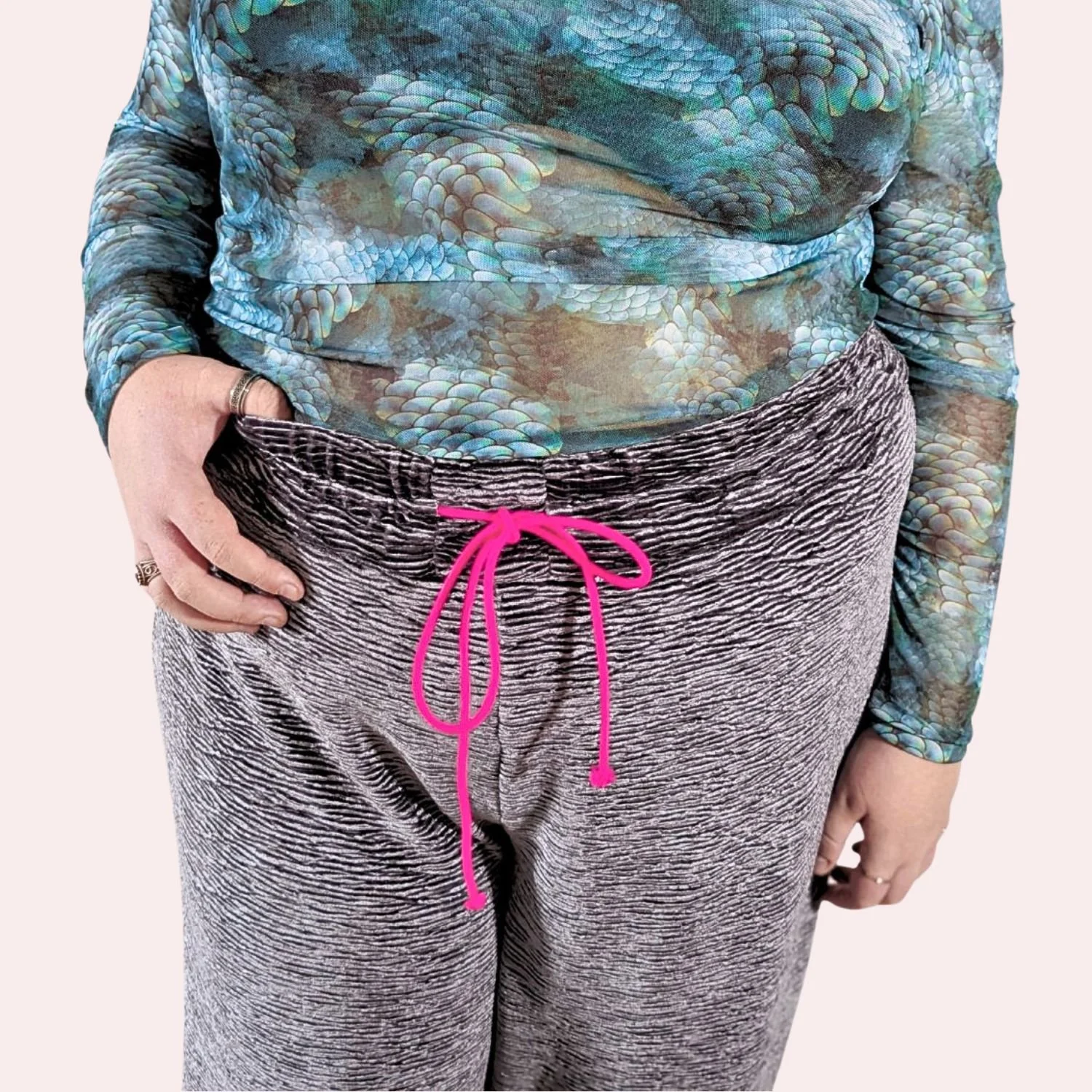 Luxury velvet joggers waist pink background .jpg
