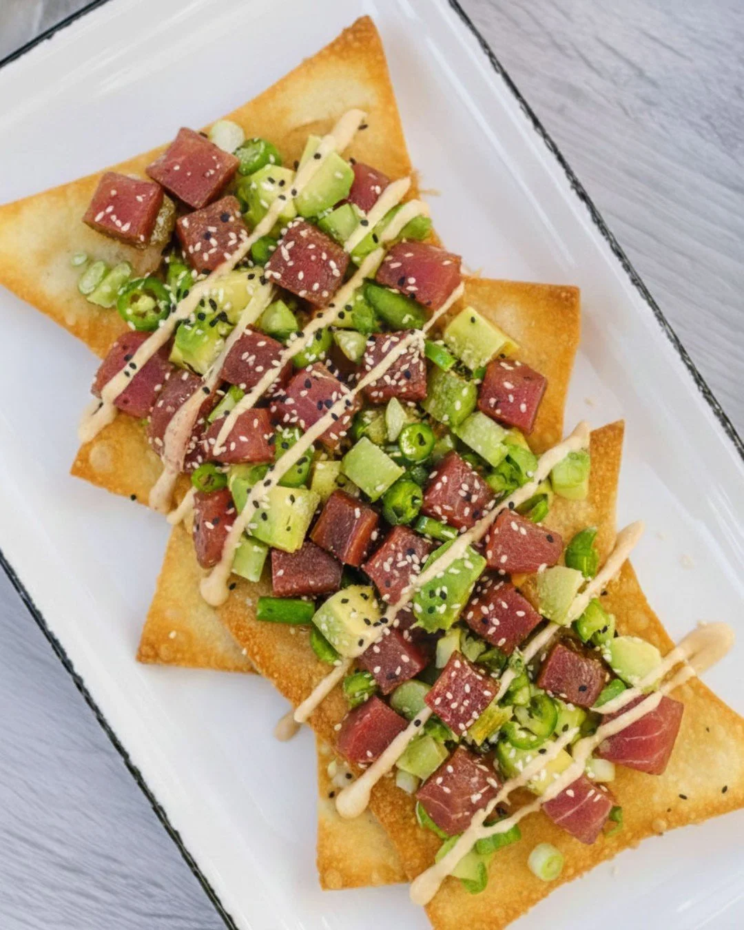 🚨 New Dish Alert 🚨

\\ Ahi Poke Nachos //
fresh ahi tuna, poke sauce, avocado, wasabi cream, sesame seeds, cilantro

Fresh, front and center.