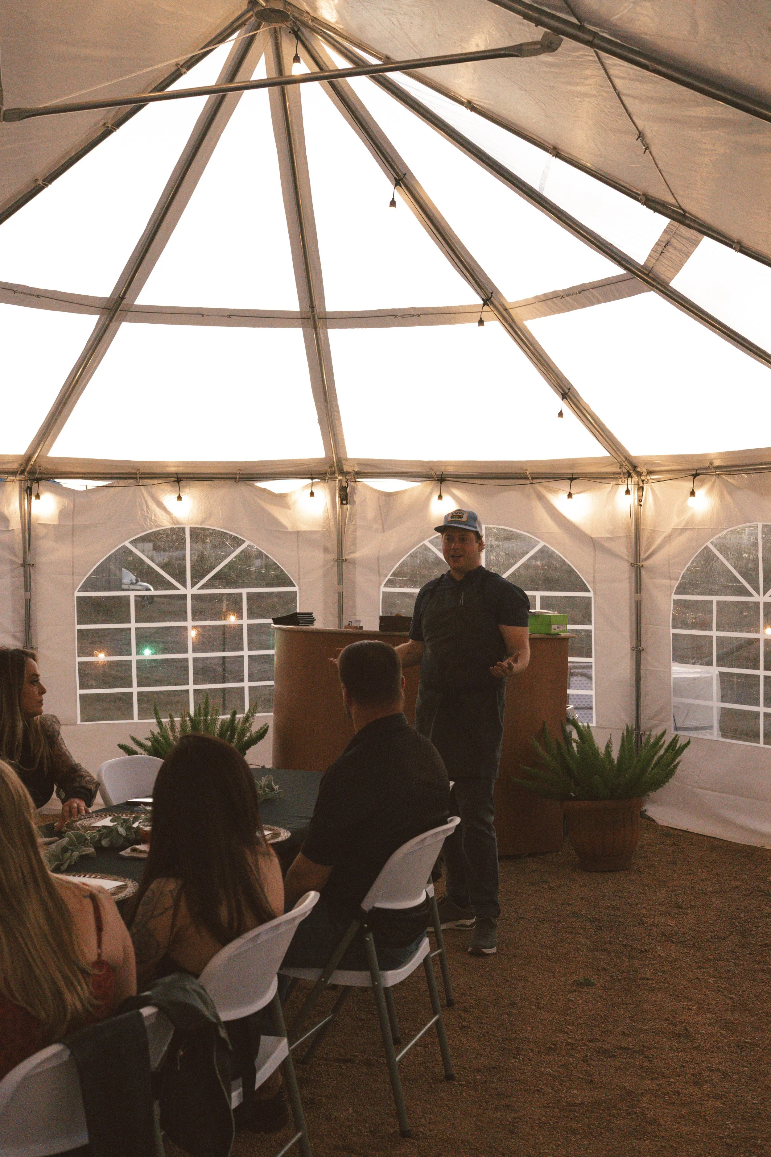 Chef Travis from Castel Greeting Guests at Popup
