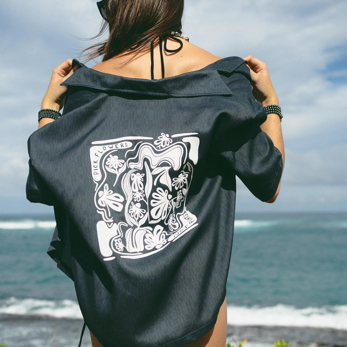 There&rsquo;s limited quantities of our original pick flowers not fights shirt- with artwork by the TI of TATI, @funkyt.art 💗💗 shop at tatihawaii.com to get yours today! They run big + baggy so size down! #organicshirt #organicclothing #organicclot