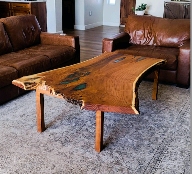 Living room with leather couches and a wooden live edge-coffee table.