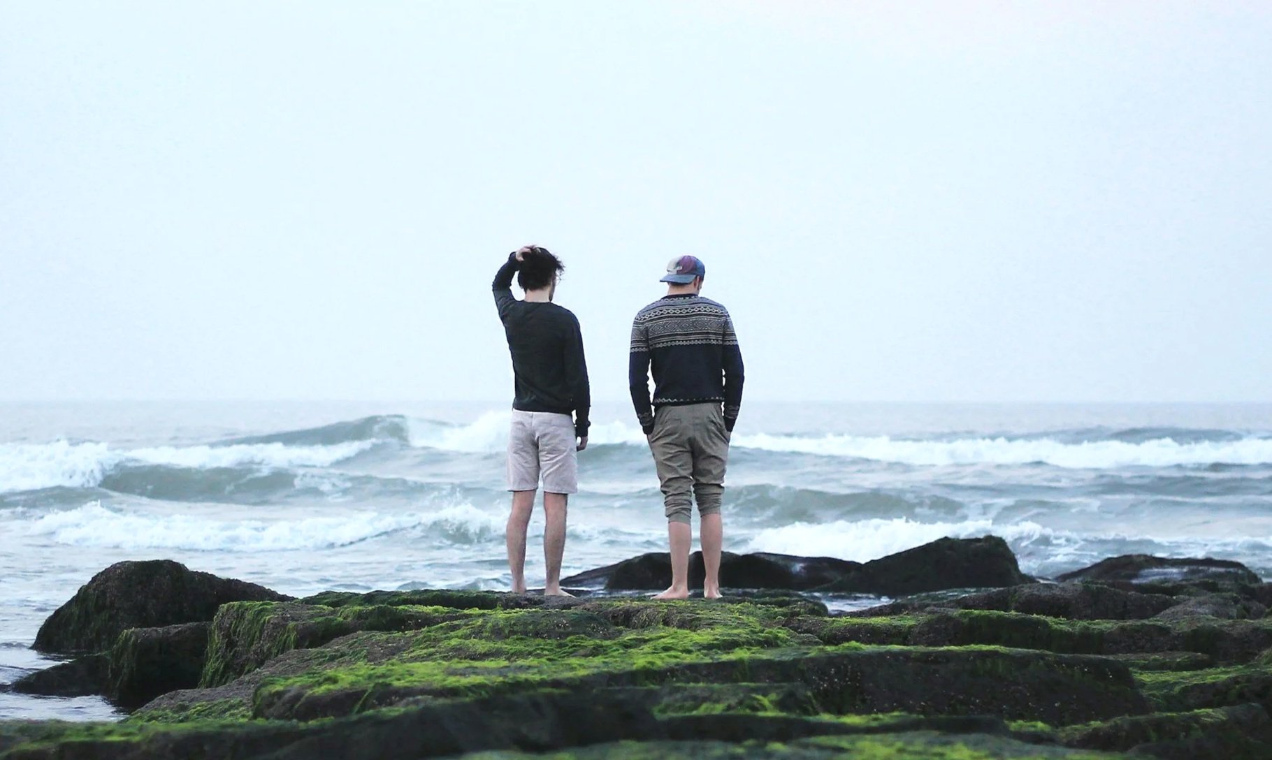Two men by the ocean