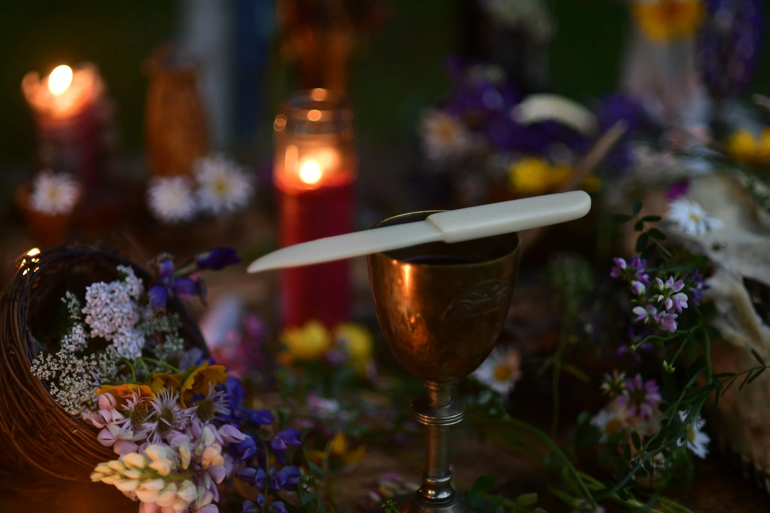 A ceremonial white knife lies across the chalice prior to the ritual. 