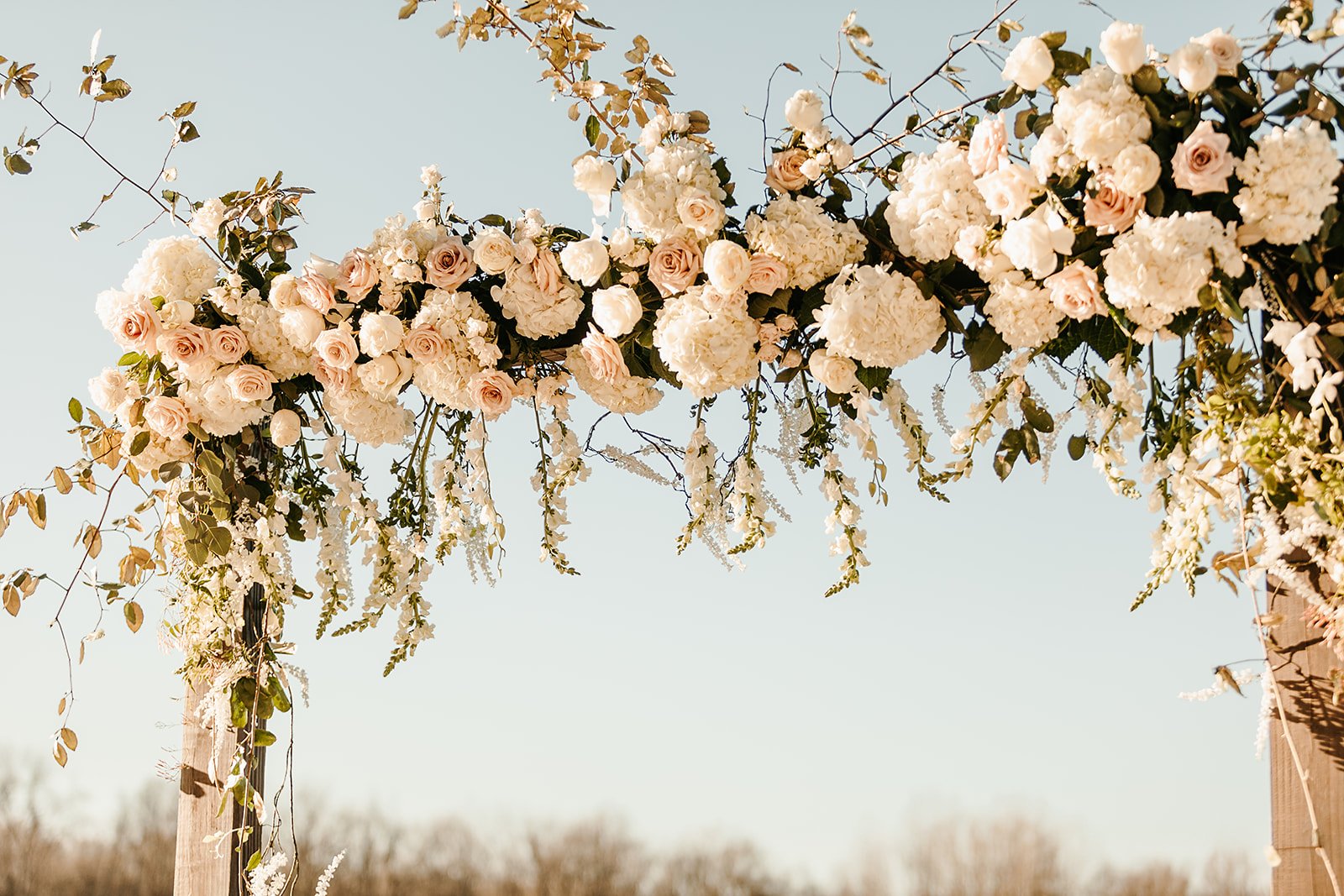 outdoor wedding floral arbor.jpeg