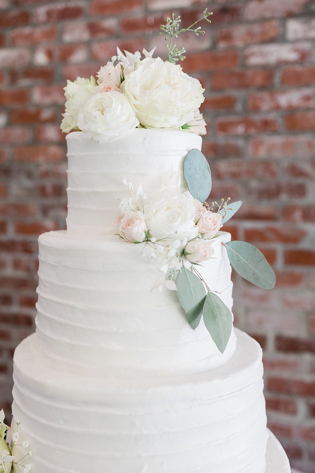 white classic wedding cake flowers.jpeg