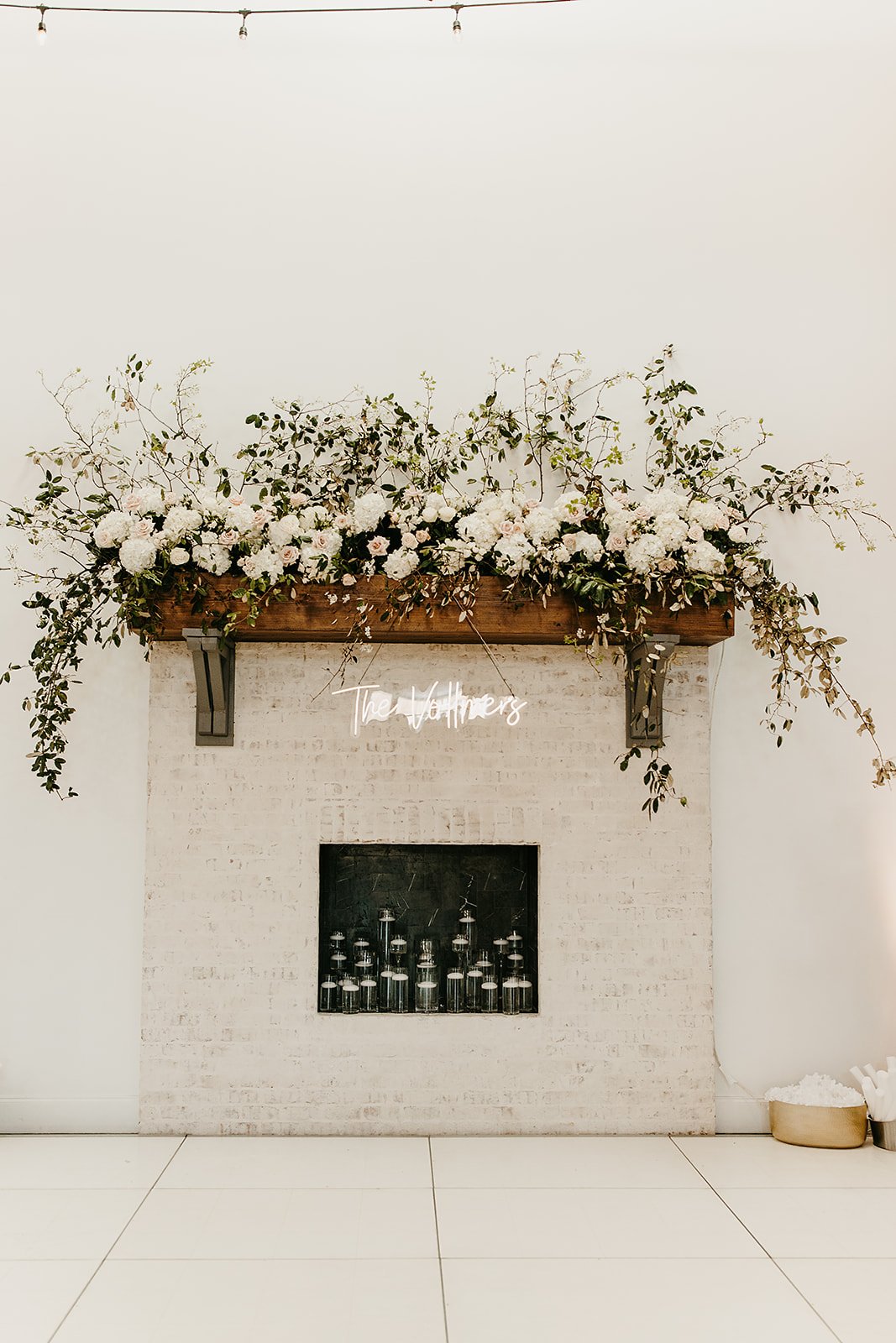 mantel floral arrangement and candles.jpeg