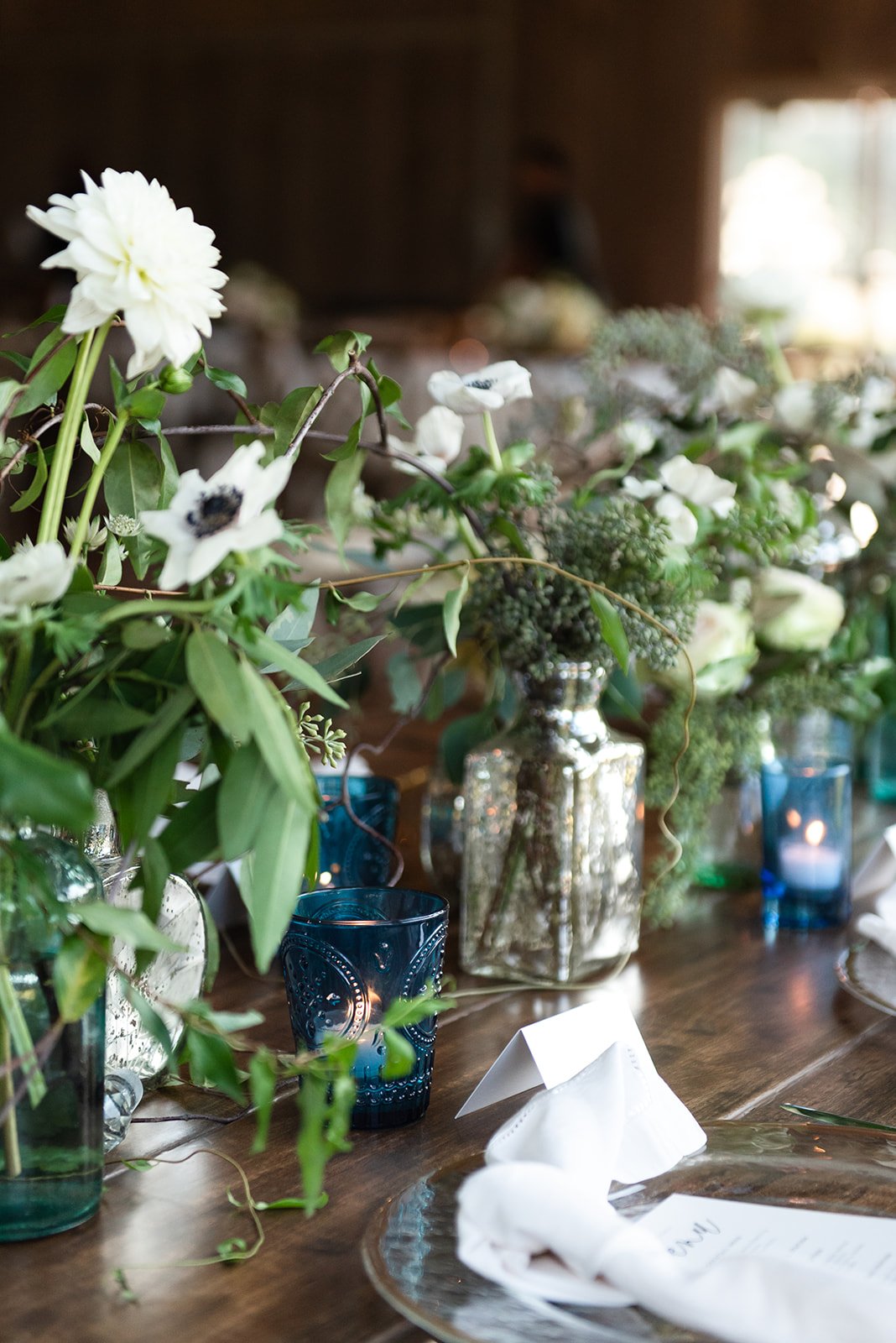 white and greenery with pops of blue.jpeg