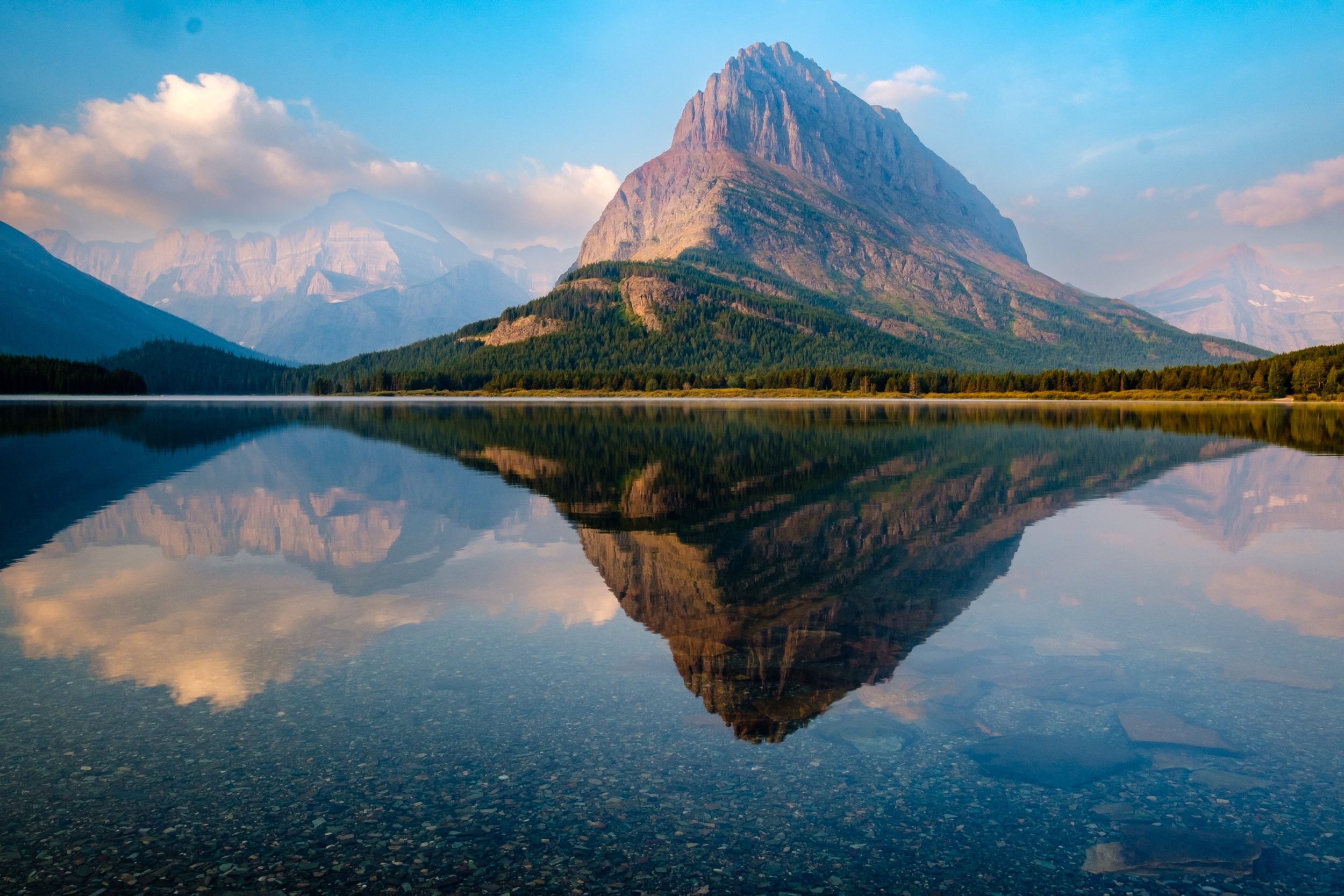 Swiftcurrent Lake Sunrise w Grinnell point reflection-2.jpg