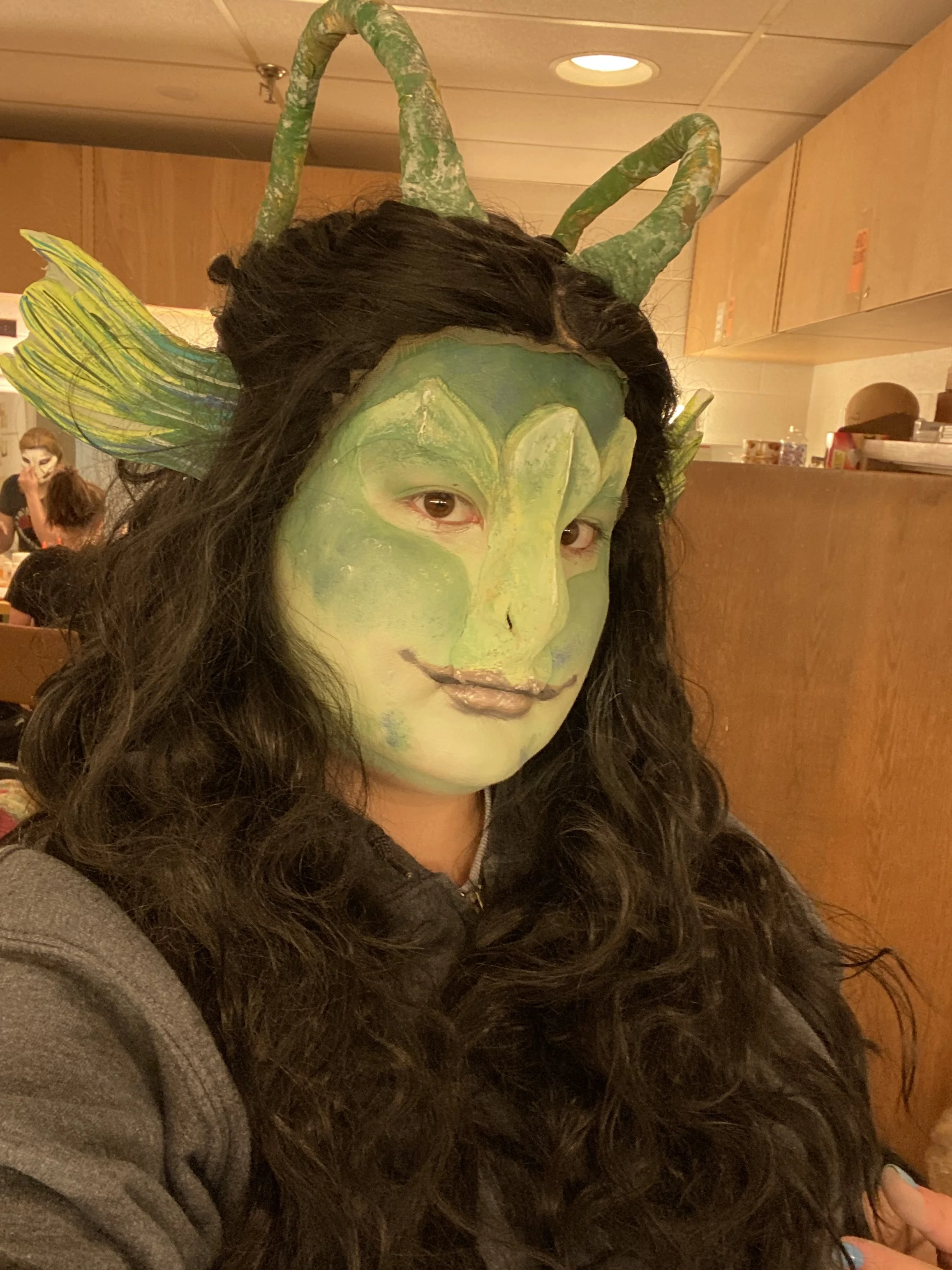Water Nixie look created with foam fins and antennae, nose and eyebrow prosthetics, wig, and creme makeup. 