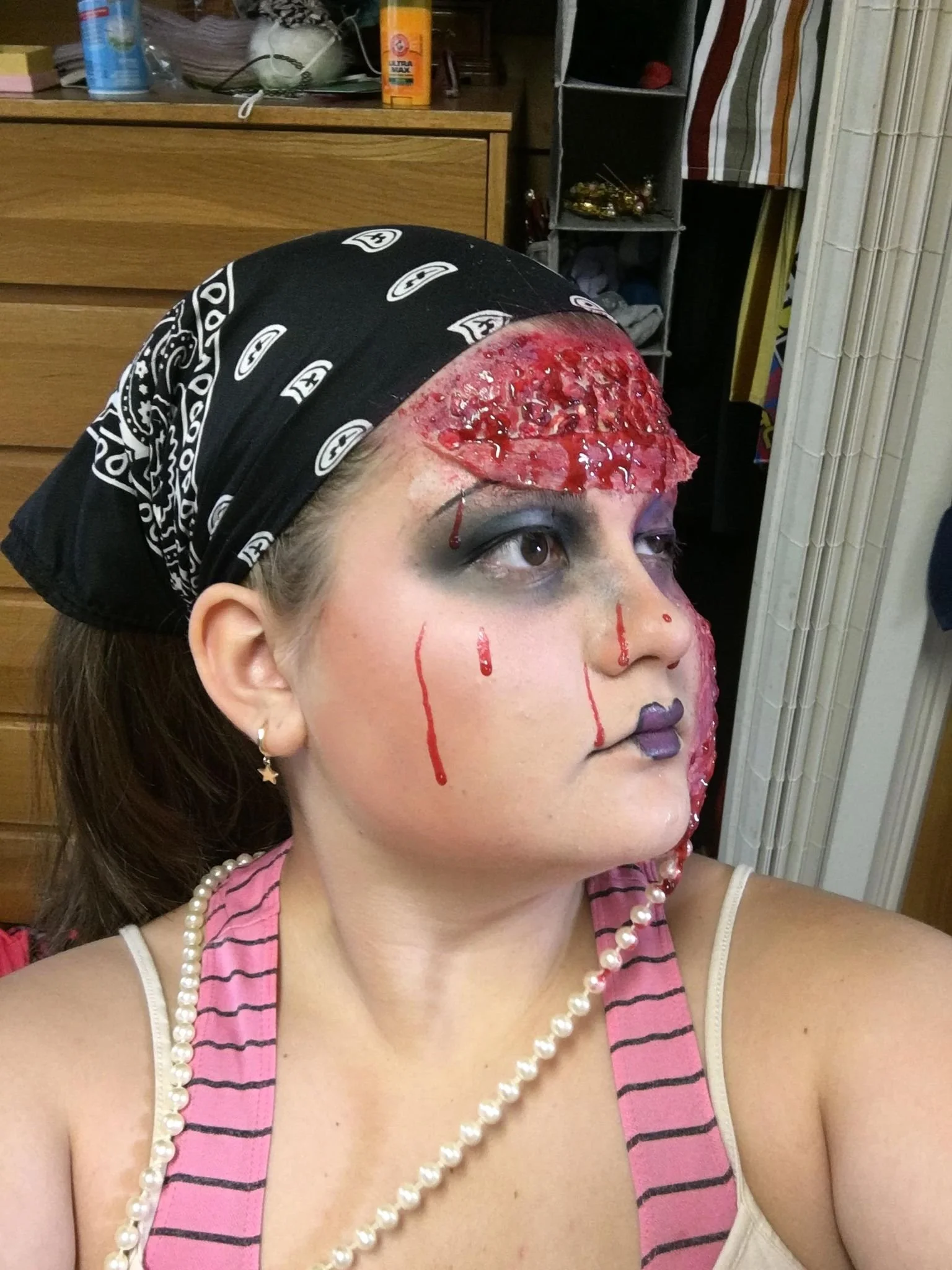 Gore Project - Forehead "flap" created with latex, oats, creme makeup and homemade blood. Swollen eye created with medical tape and creme makeup.